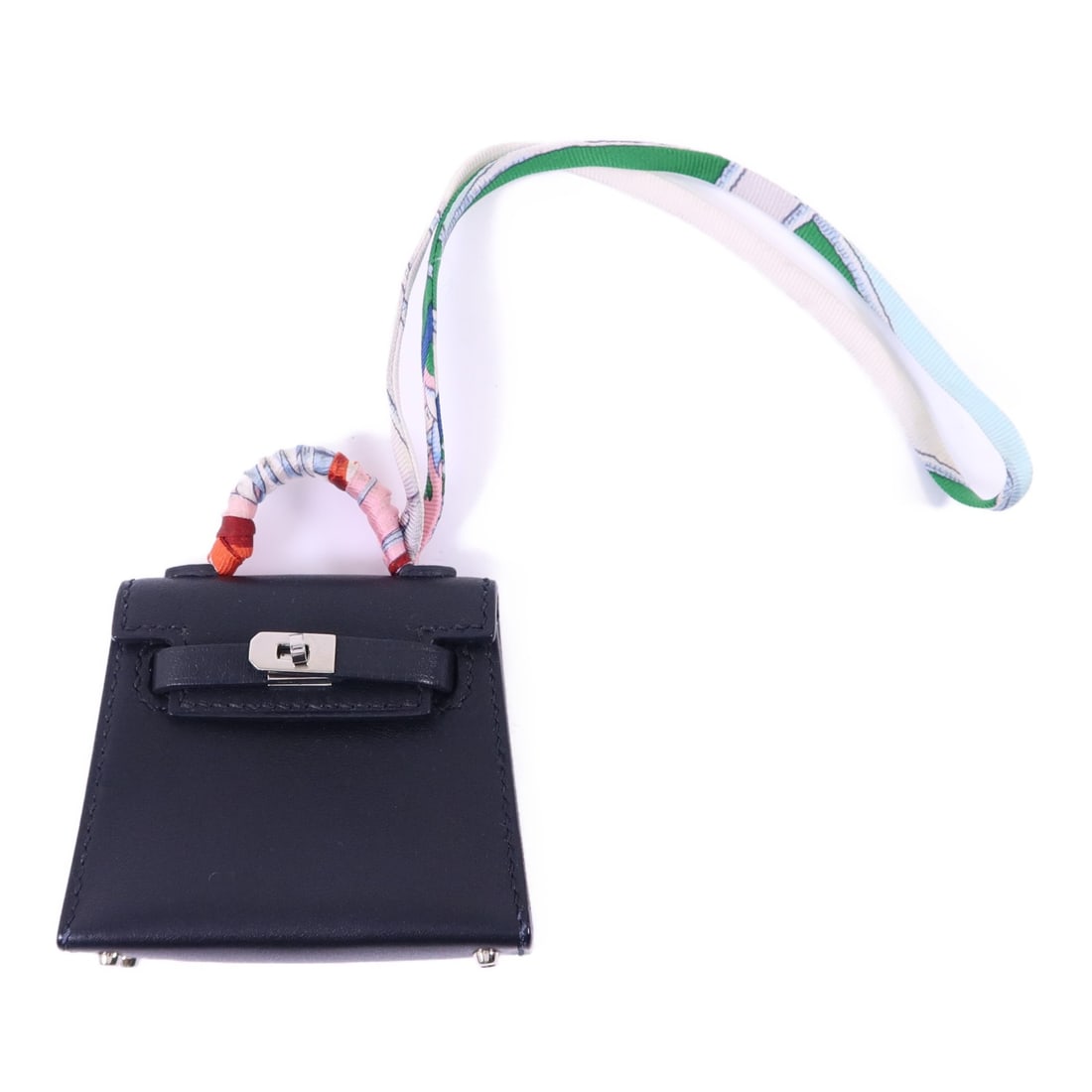 Black Tadelakt Leather Kelly Bag Charm by Hermes with Palladium Hardware: Black Tadelakt Leather Kelly Bag Charm by Hermes with Palladium Hardware This Hermes Kelly bag charm is crafted from black Tadelakt leather calfskin, offering a sophisticated accessory for your handba