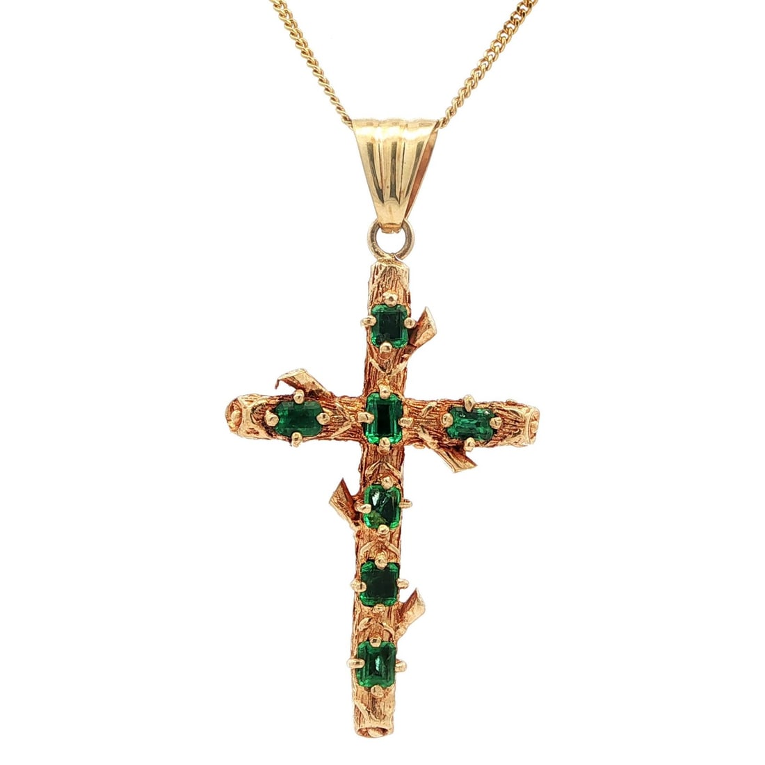 Vintage 18k Gold Emerald Cross Pendant with 24 Inch Curb Chain: Vintage 18k Gold Emerald Cross Pendant with 24 Inch Curb Chain This exquisite vintage cross pendant features a captivating design crafted in solid 18k yellow gold. Set with seven natural cushion-cut e