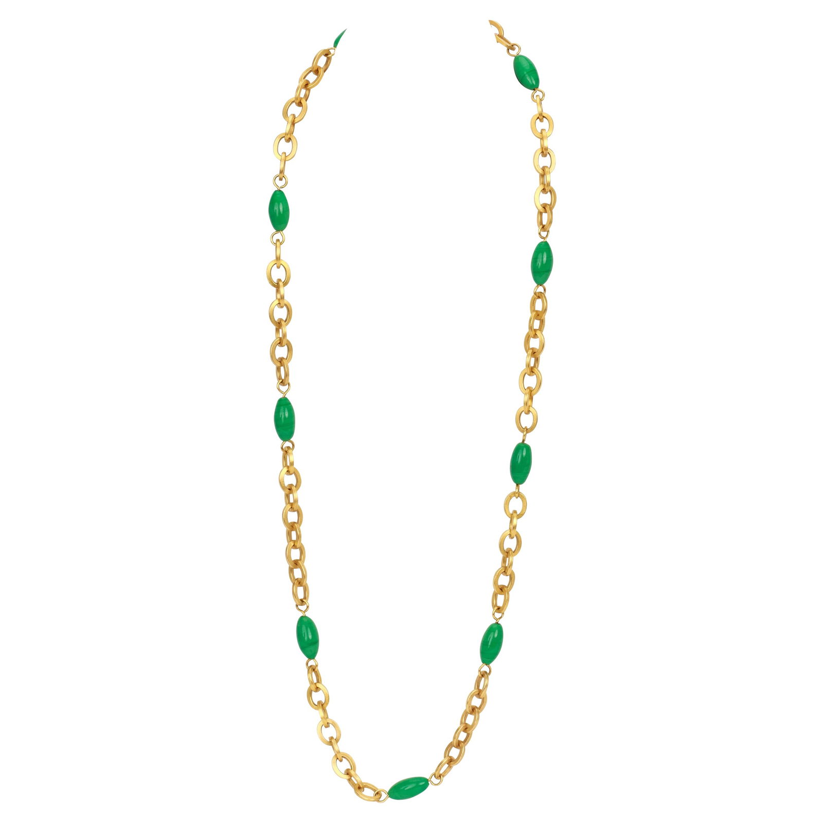 1995 Vintage Chanel Gold Sautoir Necklace with Green Gripoix Elements: 1995 Vintage Chanel Gold Sautoir Necklace with Green Gripoix Elements This exquisite vintage Chanel gold sautoir necklace from the Spring 1995 collection features nine decorative gripoix elements with