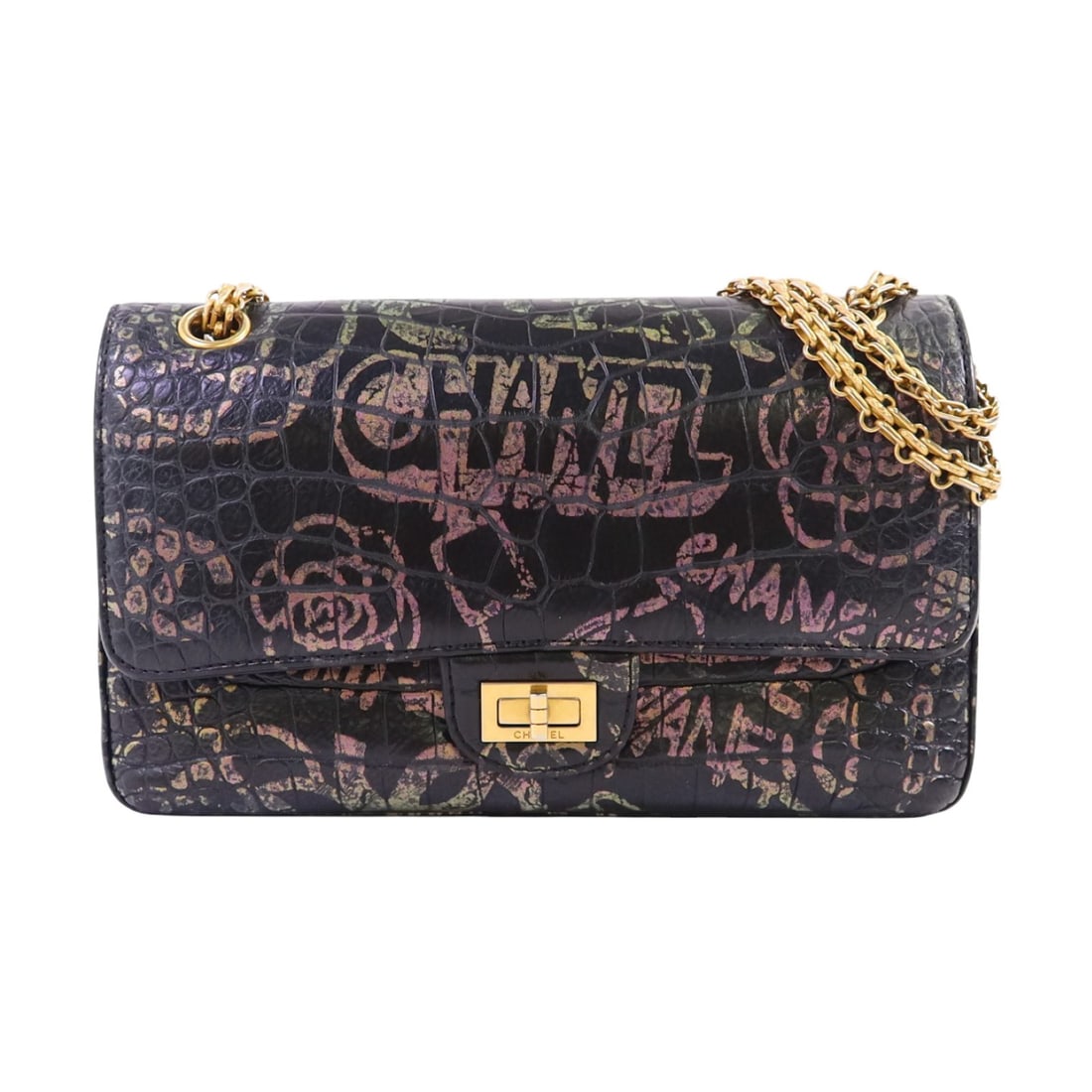 Black Embossed Calfskin 2.55 Graffiti Shoulder Bag with Gold Hardware by Chanel: Black Embossed Calfskin 2.55 Graffiti Shoulder Bag with Gold Hardware by Chanel This Chanel 2.55 Reissue shoulder bag features embossed calfskin leather in black with a distinctive graffiti motif. It