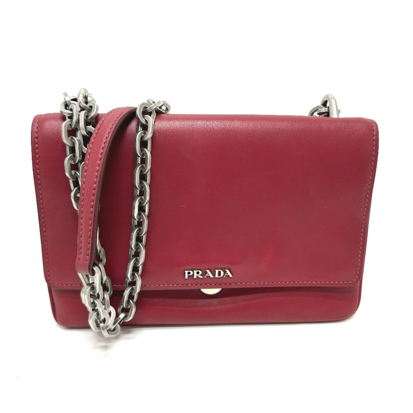 Red Leather Shoulder Bag by Prada for Women: Red Leather Shoulder Bag by Prada for Women This Prada women's bag features a red leather exterior and compact dimensions, offering a stylish accessory with Italian craftsmanship. The bag shows minor