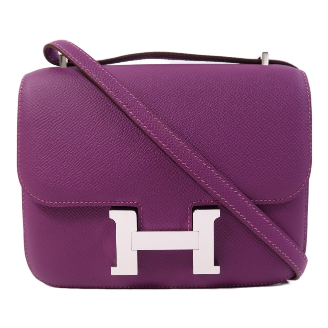 Hermes Constance Mini Purple Epsom Leather Shoulder Bag with Palladium Hardware: Hermes Constance Mini Purple Epsom Leather Shoulder Bag with Palladium Hardware This Hermes Constance Mini 2-way shoulder bag is crafted from Veau Epsom calfskin leather in a striking purple shade. Ma