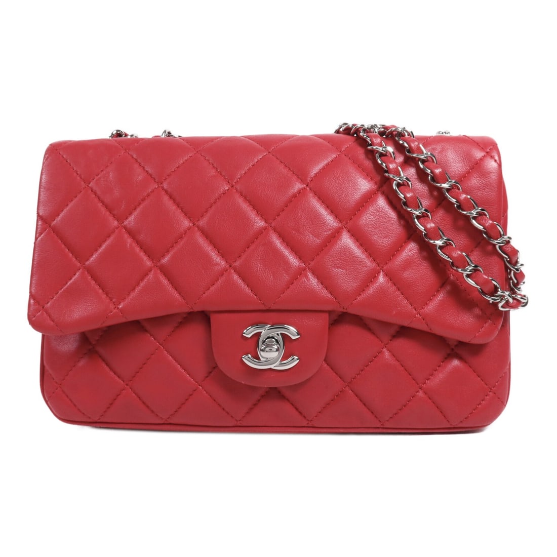 CHANEL Red Lambskin Leather Shoulder Bag with Chain SHW: CHANEL Red Lambskin Leather Shoulder Bag with Chain SHW This exquisite CHANEL CC Shoulder Bag is crafted from luxurious lambskin leather in a striking red hue. Designed for stylish functionality, it f