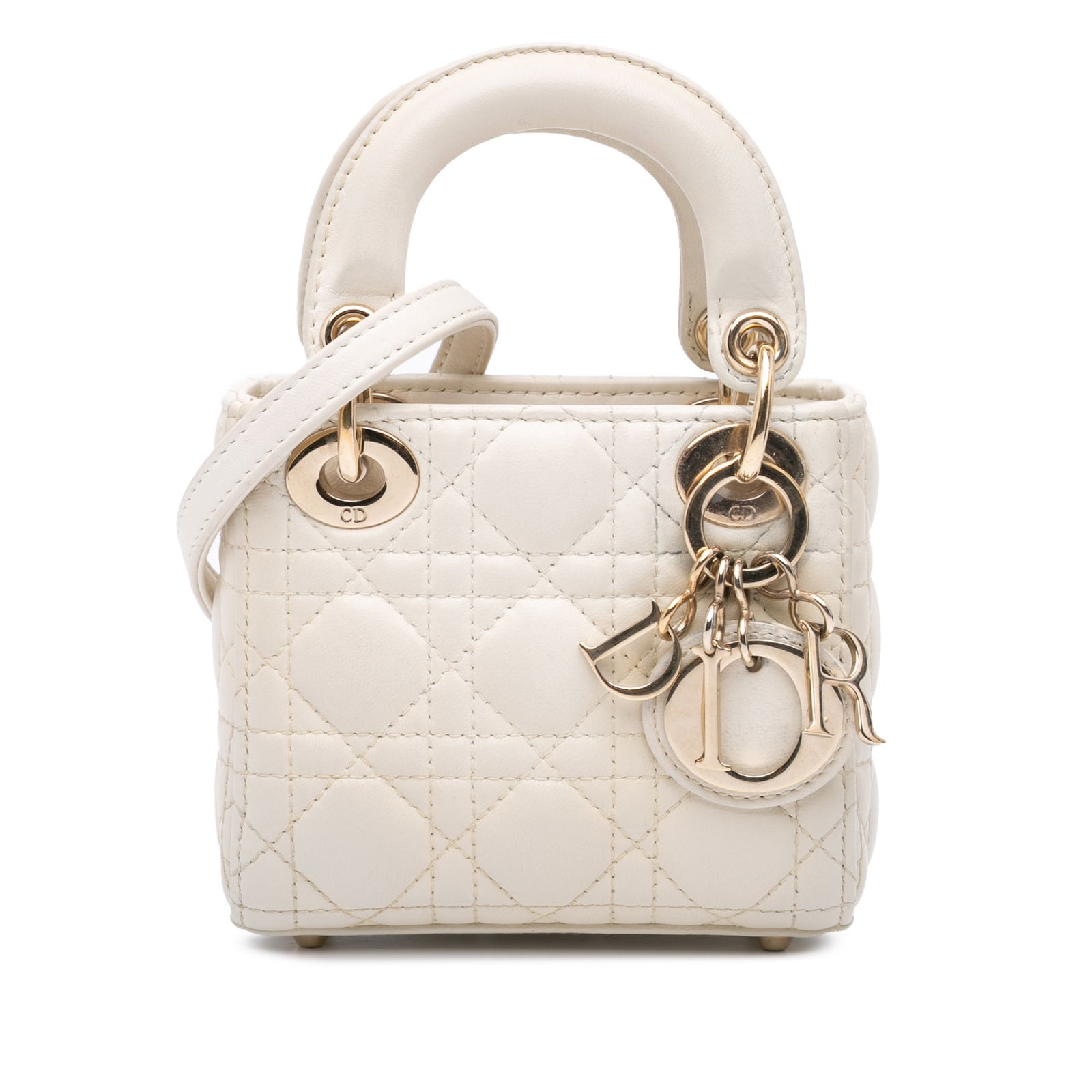 Dior Micro Lambskin Cannage Lady Dior White Handbag with Detachable Strap: Dior Micro Lambskin Cannage Lady Dior White Handbag with Detachable Strap The Micro Lady Dior is an exquisite handbag crafted from quilted lambskin leather, showcasing a luxurious white finish. This e