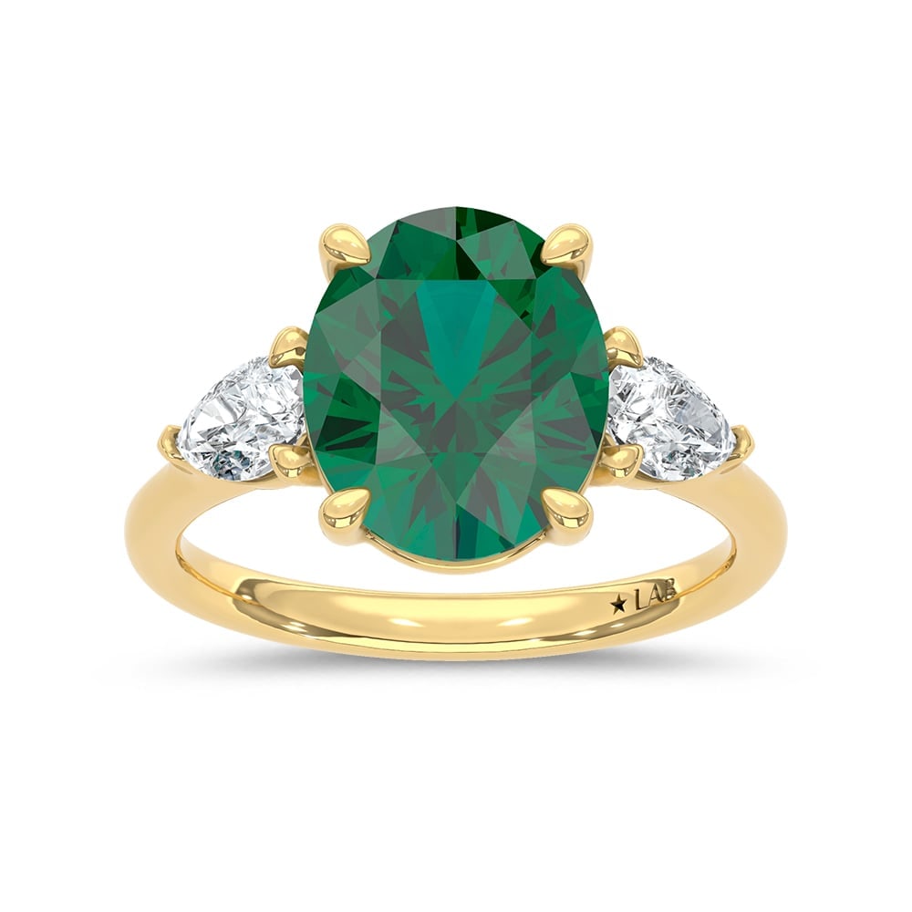 14K Yellow Gold Lab Grown Diamond 4 Ct.Tw. Oval Shape Recrystalized Emerald Engagement Ring (Center: 14K Yellow Gold Lab Grown Diamond 4 Ct.Tw. Oval Shape Recrystalized Emerald Engagement Ring (Center 3 3/8 ct) Celebrate timeless elegance with this 14K yellow gold engagement ring, featuring a dazzlin