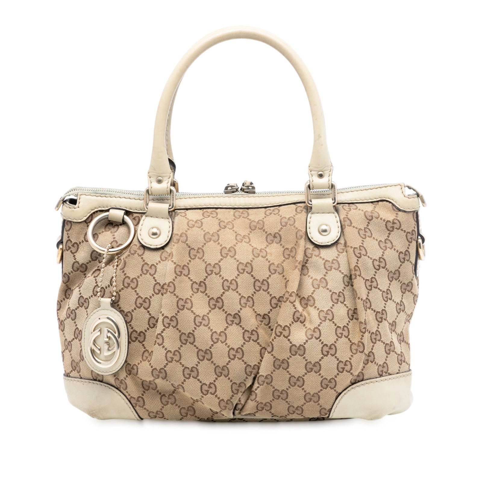 Brown GG Canvas Sukey Satchel Bag by Gucci with Leather Trim: Brown GG Canvas Sukey Satchel Bag by Gucci with Leather Trim This Gucci GG Canvas Sukey Satchel features a brown canvas body with leather trim, rolled leather handles, a top zip closure, and interior