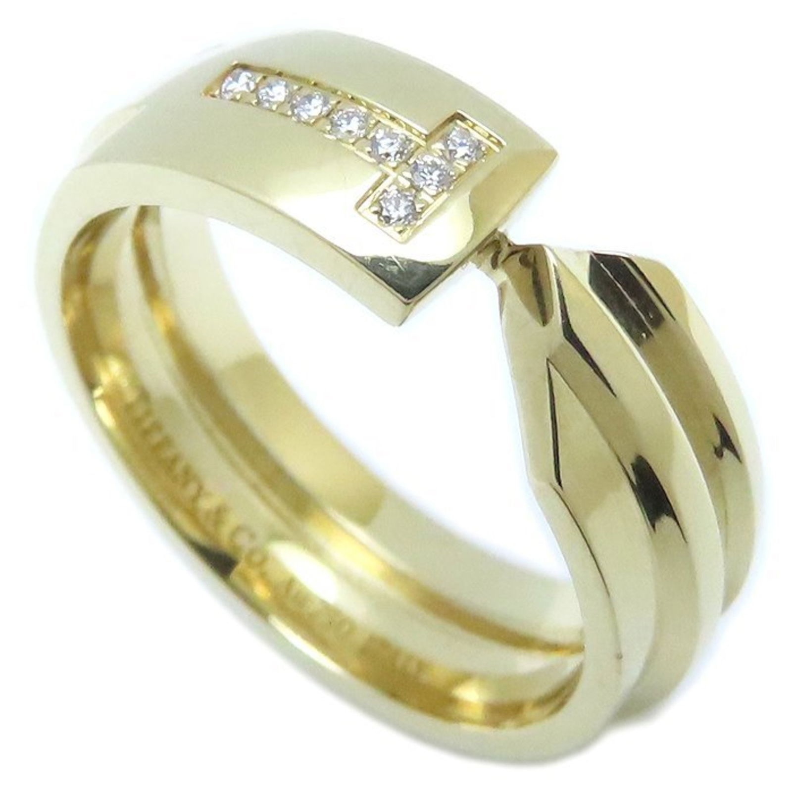 Yellow Gold T Bracelet by Tiffany & Co Size 5: Yellow Gold T Bracelet by Tiffany & Co Size 5 This Tiffany & Co. T model ring is crafted from yellow gold and designed for women. It features a gold color and is made in Italy. The ring shows slight s