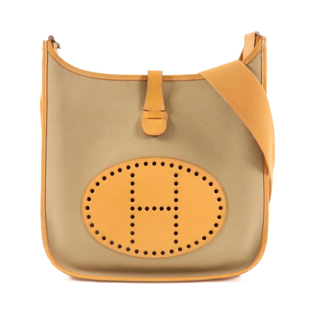 Green Canvas Evelyne PM Shoulder Bag by Hermes with Palladium Hardware: Green Canvas Evelyne PM Shoulder Bag by Hermes with Palladium Hardware This Hermes Evelyne PM shoulder bag features a green canvas exterior and is designed for regular size use. The bag is equipped wi