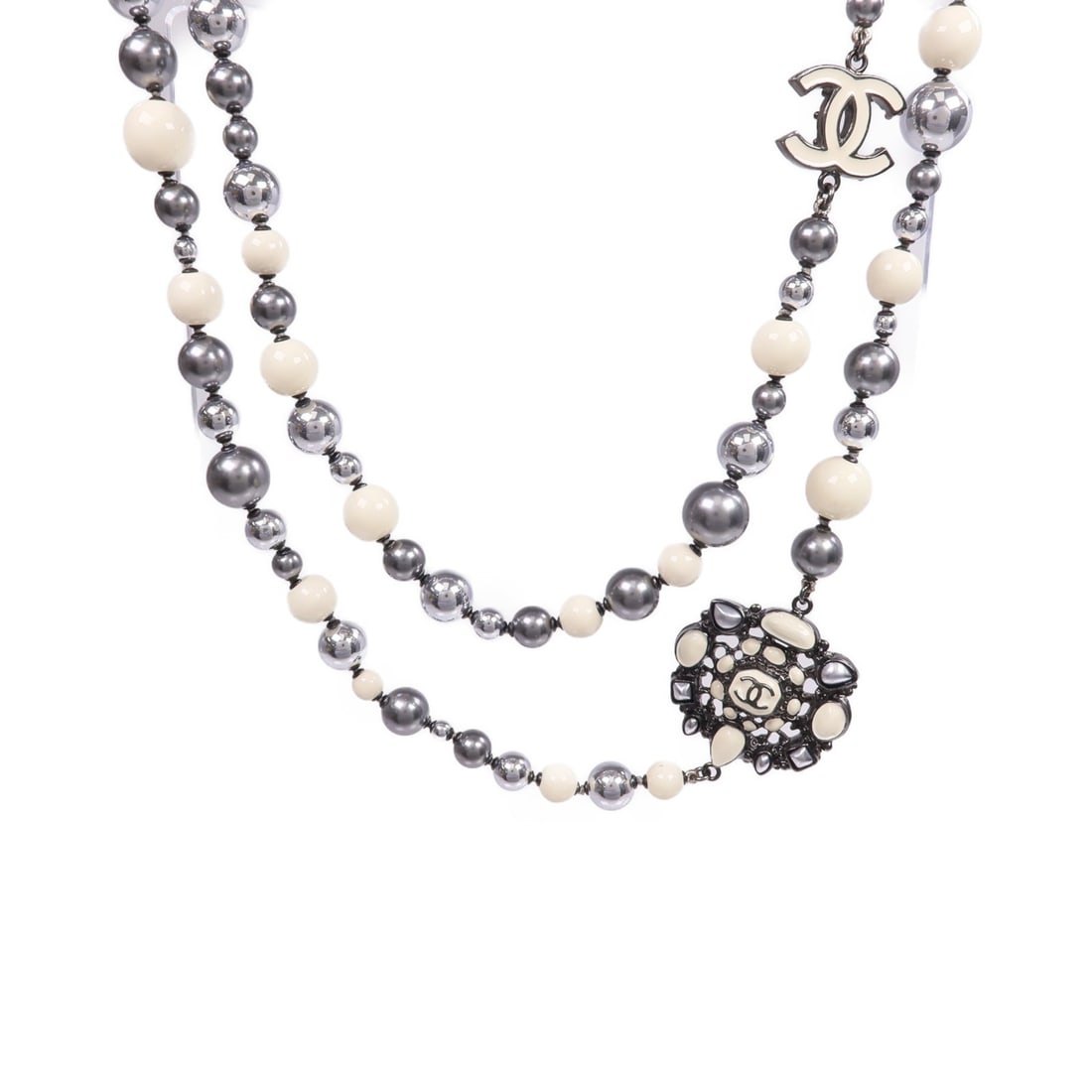 Chanel White CC Pendant Necklace in Silver Tone Metal and PVC: Chanel White CC Pendant Necklace in Silver Tone Metal and PVC This CHANEL necklace features a signature CC design crafted from PVC and metal in a stylish silver and white color combination. Made in Fr