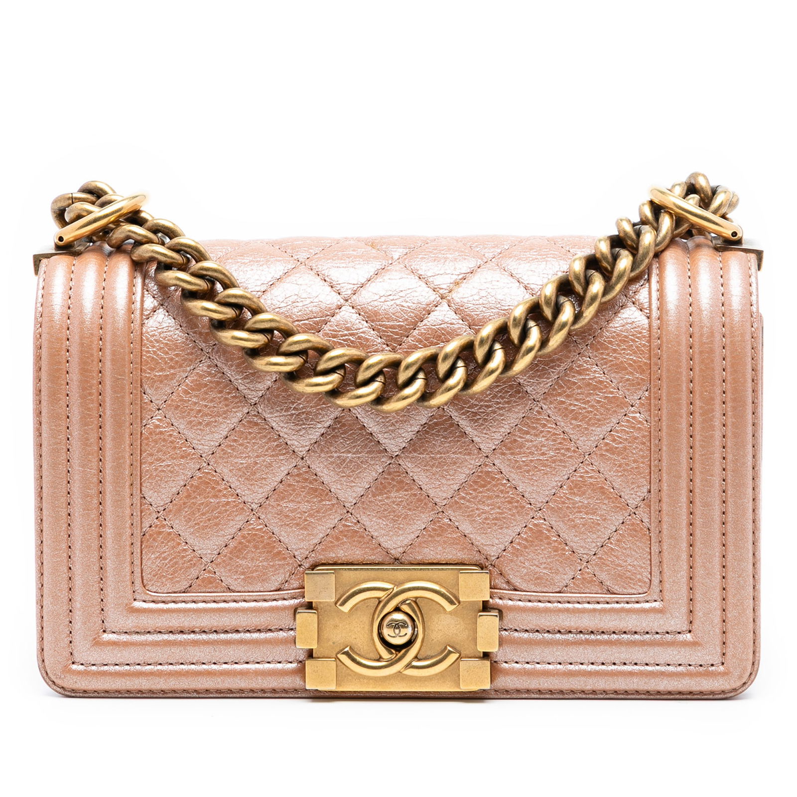 Chanel Boy Small Orange Metallic Quilted Calfskin Crossbody Bag: Chanel Boy Small Orange Metallic Quilted Calfskin Crossbody Bag This Chanel Small Quilted Metallic Calfskin Boy Flap crossbody bag features a quilted metallic calf leather exterior in orange, a curb c