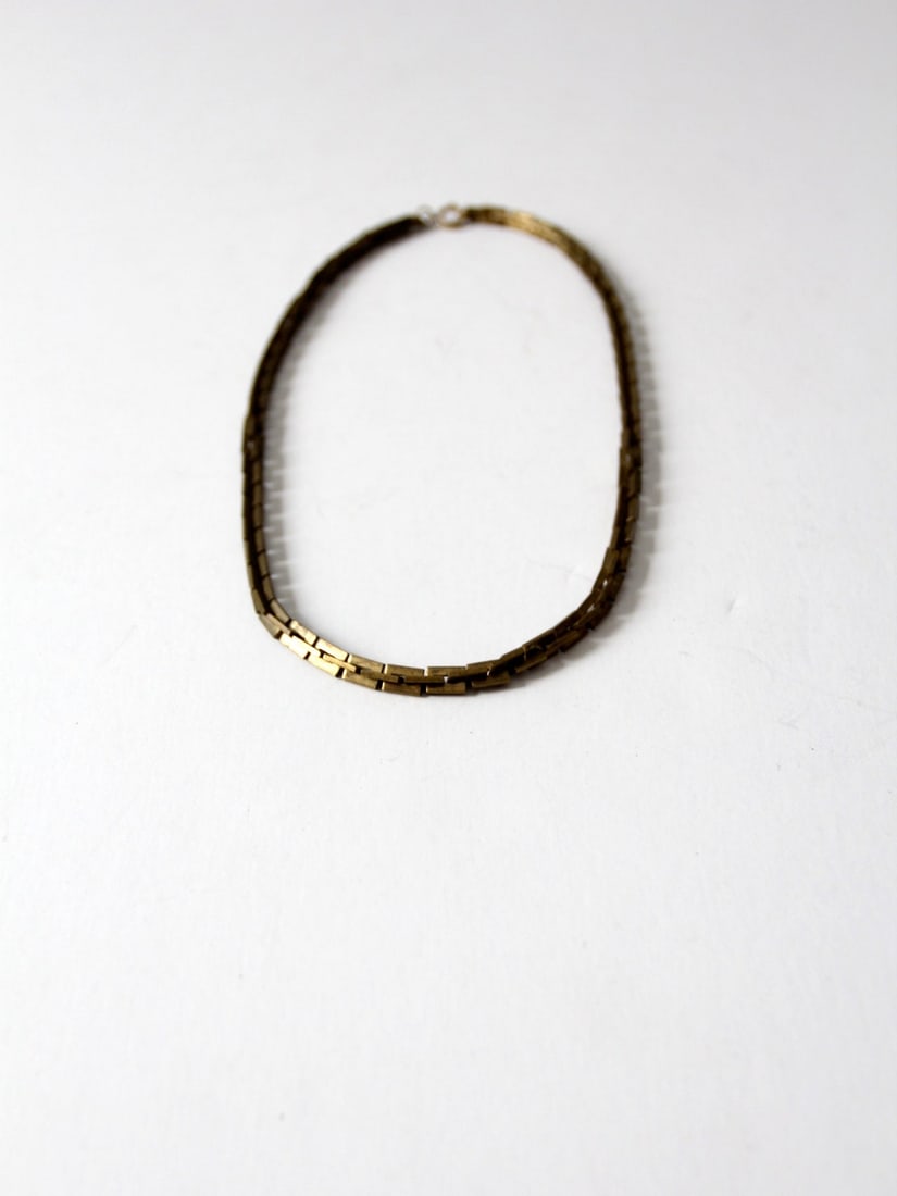 Vintage Brass Chain Link Necklace 21 Inch with Spring Ring Clasp: Vintage Brass Chain Link Necklace 21 Inch with Spring Ring Clasp This vintage brass chain link necklace features square notched links that elegantly connect to form a striking piece. It is secured wit