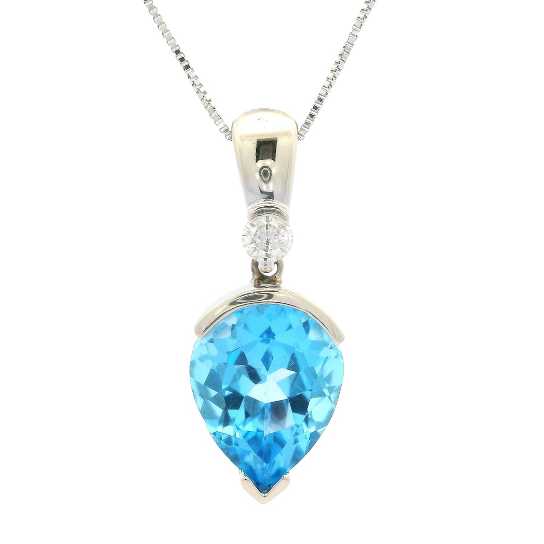 14k White Gold Tear Drop Blue Topaz Diamond Pendant Necklace: 14k White Gold Tear Drop Blue Topaz Diamond Pendant Necklace This stunning pendant necklace features a 14k white gold inverse tear drop design, showcasing a beautiful pear-shaped blue topaz at its cen