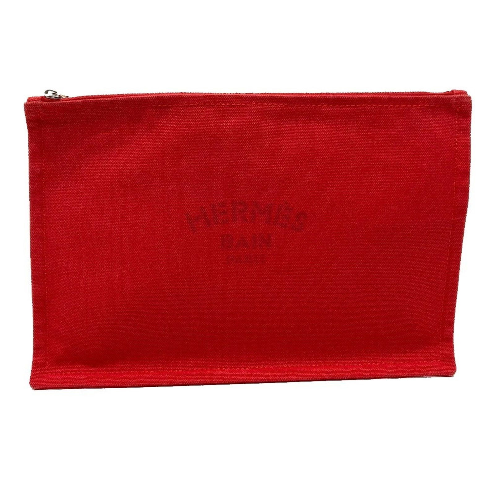 Red Cotton Hermes Yachting Clutch Bag 18cm x 28cm: Red Cotton Hermes Yachting Clutch Bag 18cm x 28cm This Hermes Yachting model features a red cotton exterior and is designed for universal use. Made in France, the item displays some traces of usage, i