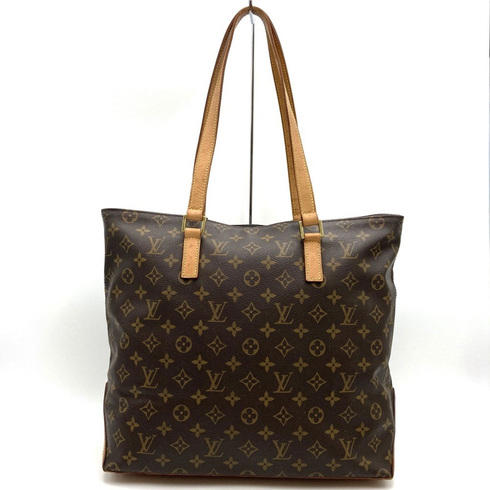 Louis Vuitton Mezzo Brown Canvas Tote Bag: Louis Vuitton Mezzo Brown Canvas Tote Bag This Louis Vuitton Mezzo tote is crafted from brown canvas and designed for women. Made in France, the bag features a spacious interior and classic style. The