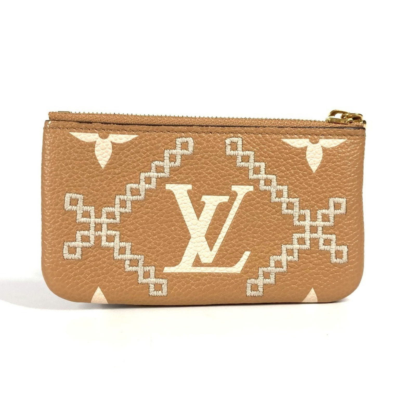 Beige Leather Louis Vuitton 6.5cm x 11.5cm Key Holder Pouch: Beige Leather Louis Vuitton 6.5cm x 11.5cm Key Holder Pouch This Louis Vuitton key pouch is crafted from beige leather and features a compact design. Made in France, it offers secure storage for keys