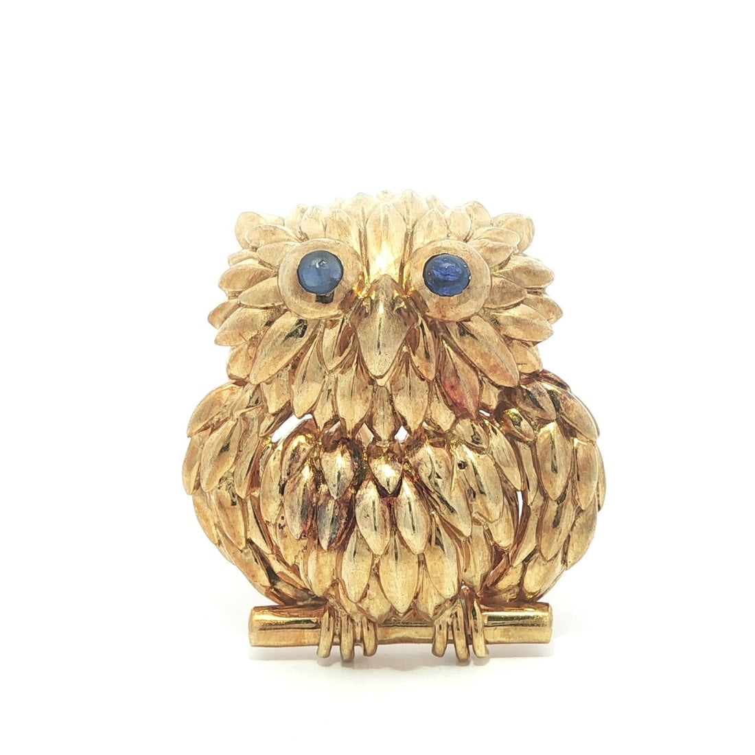 18K Yellow Gold Owl Brooch with Sapphire Eyes by Tiffany & Co.: 18K Yellow Gold Owl Brooch with Sapphire Eyes by Tiffany & Co. This whimsical Tiffany & Co. owl pin brooch is crafted from solid 18k yellow gold and set with two natural round cabochon-cut blue sapphi