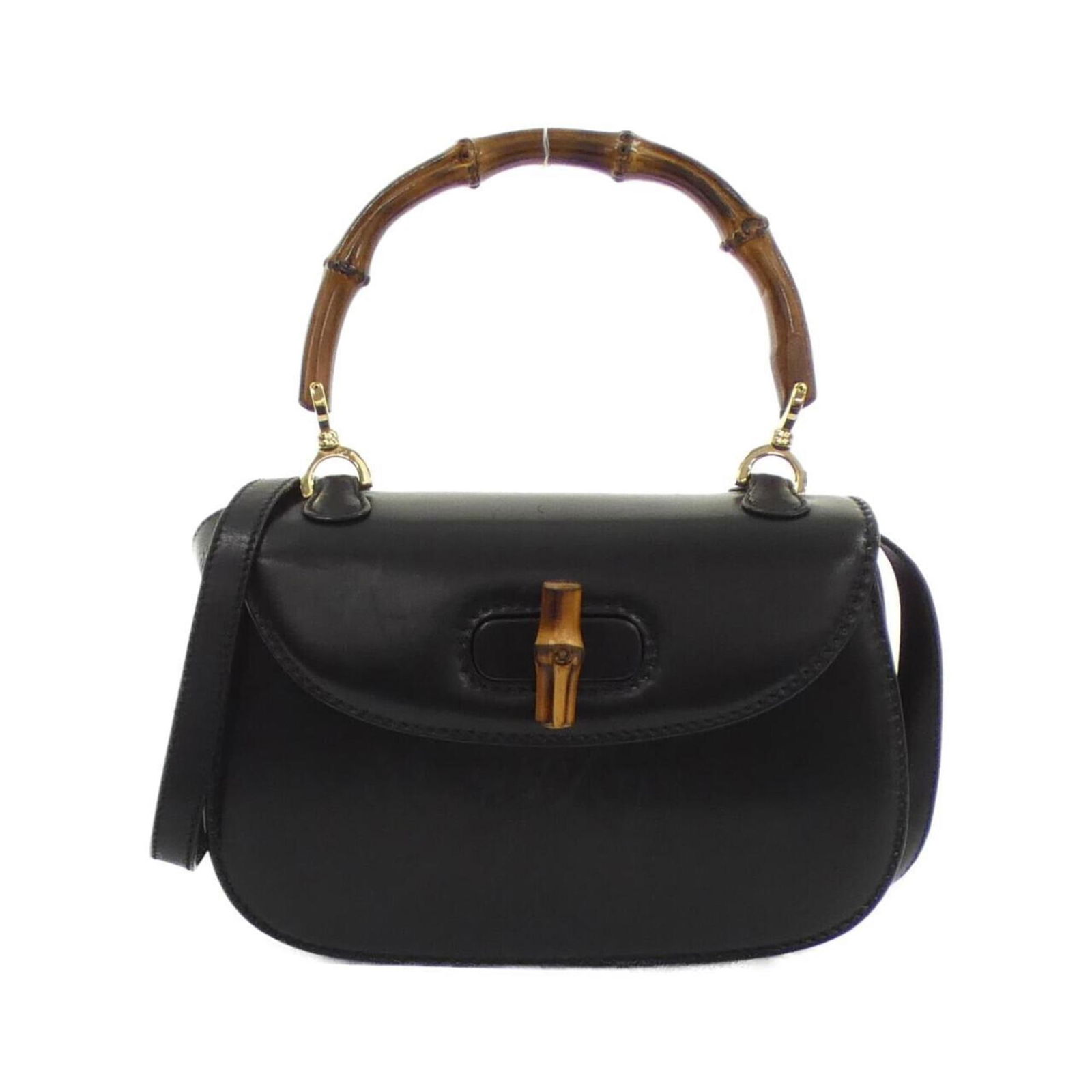 Black Leather Gucci Bamboo Shoulder Bag Italy: Black Leather Gucci Bamboo Shoulder Bag Italy This Gucci Bamboo handbag features a black leather exterior with iconic bamboo handle detail. Designed for women, it offers a compact and elegant silhouet
