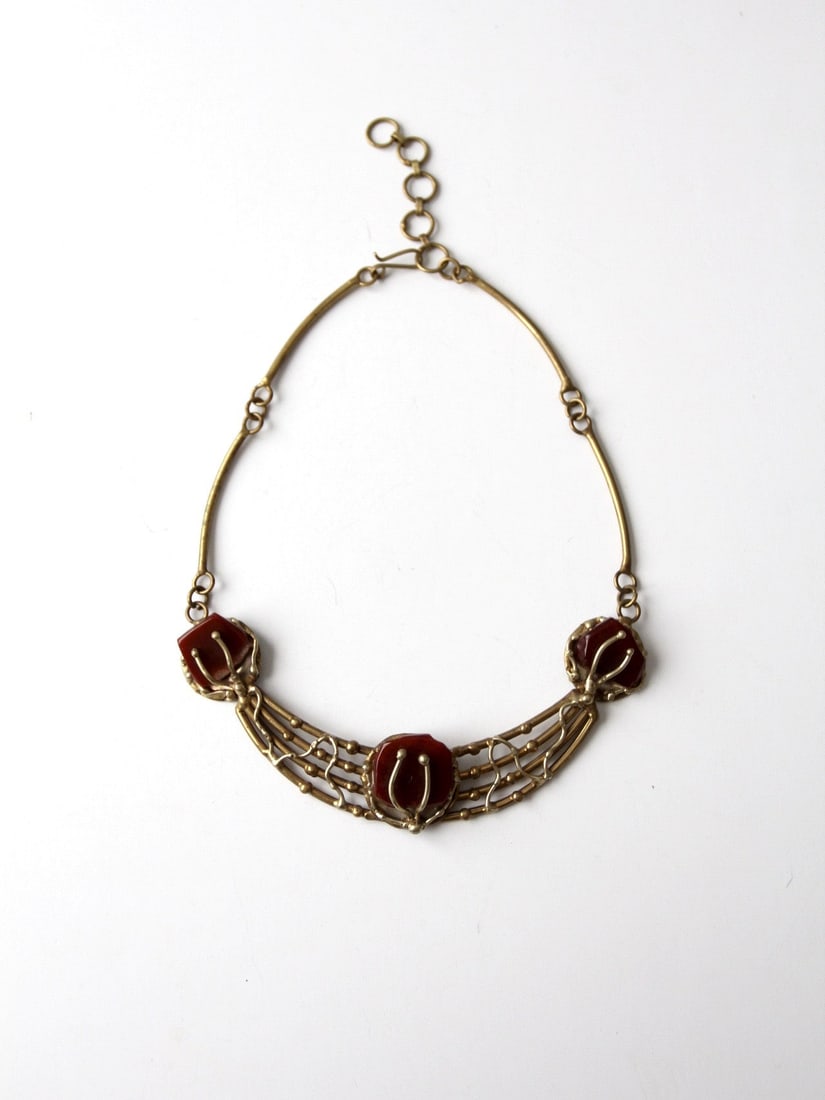 1960s Vintage Brutalist Brass Necklace with Blue Agate Centerpiece: 1960s Vintage Brutalist Brass Necklace with Blue Agate Centerpiece Discover a stunning vintage 1960s brutalist necklace, expertly crafted with layered brasswork and featuring a striking light blue aga