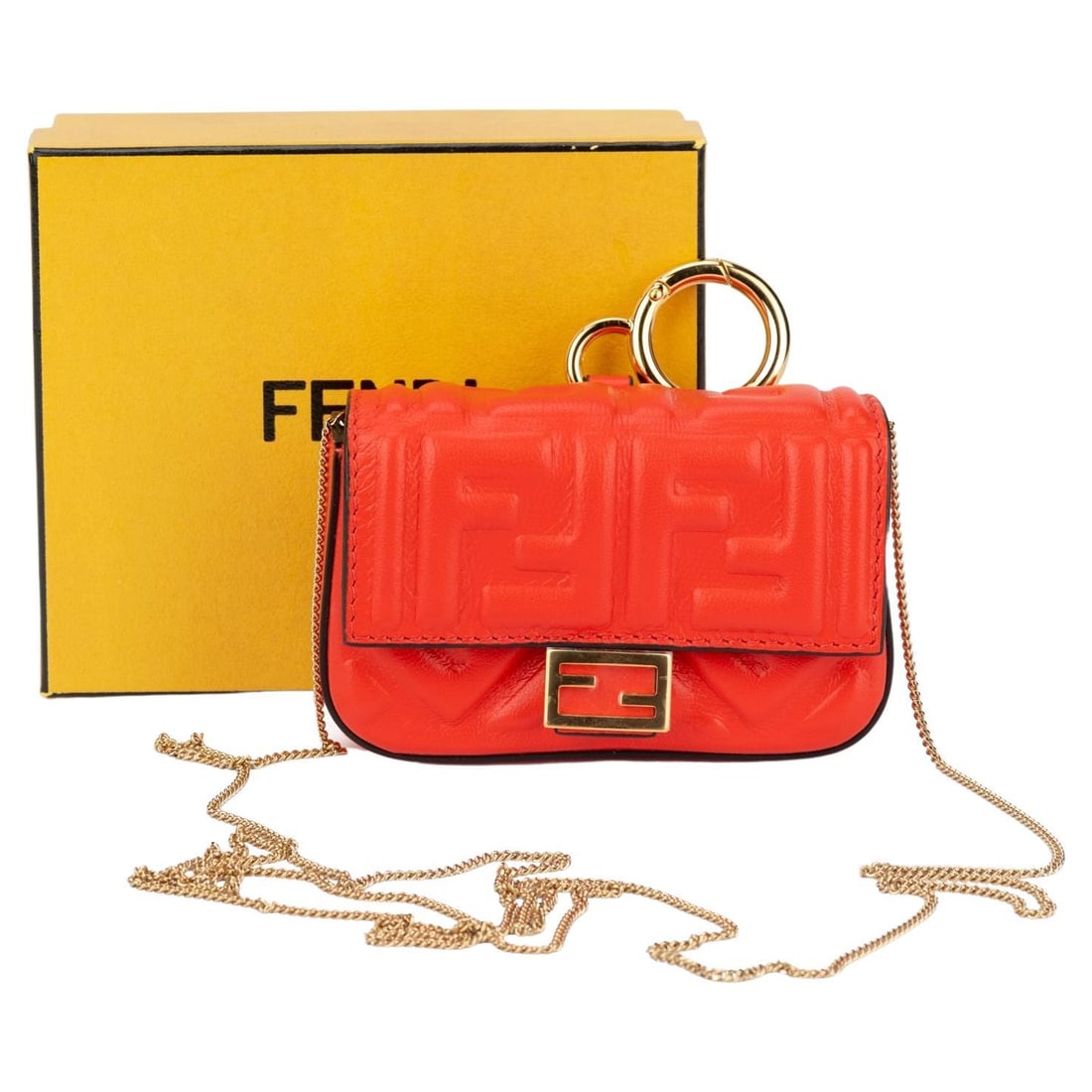 Fendi Coral Embossed Nano Baguette with Gold Tone Hardware: Fendi Coral Embossed Nano Baguette with Gold Tone Hardware This Fendi Nano Baguette is an exquisite accessory, featuring a stunning coral embossed logo design that captures the essence of luxury. It i
