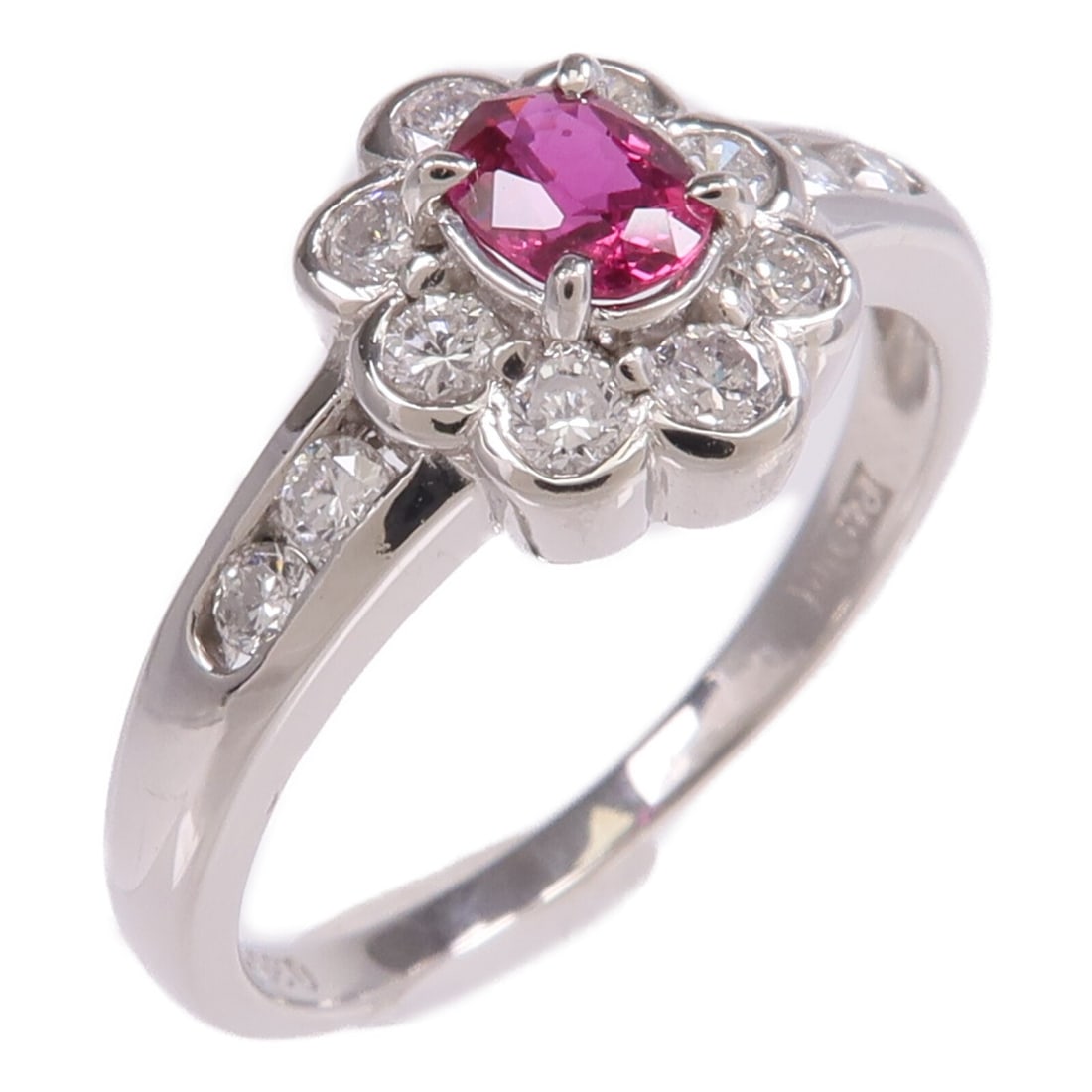 Pt900 Platinum Ring with Ruby and Diamond Accents Size 7.25: Pt900 Platinum Ring with Ruby and Diamond Accents Size 7.25 This ring features a vibrant ruby as the main stone set in PT900 platinum. The ring is designed in a regular size US 7.25 and is in very goo
