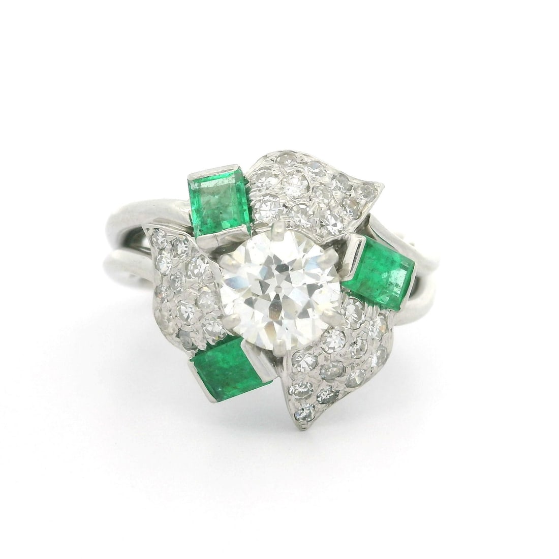 Vintage 1940s Platinum Diamond Emerald Flower Cocktail Ring 1.98ctw: Vintage 1940s Platinum Diamond Emerald Flower Cocktail Ring 1.98ctw This stunning vintage cocktail ring from the 1940s features a beautiful floral design crafted in luxurious platinum. It showcases a