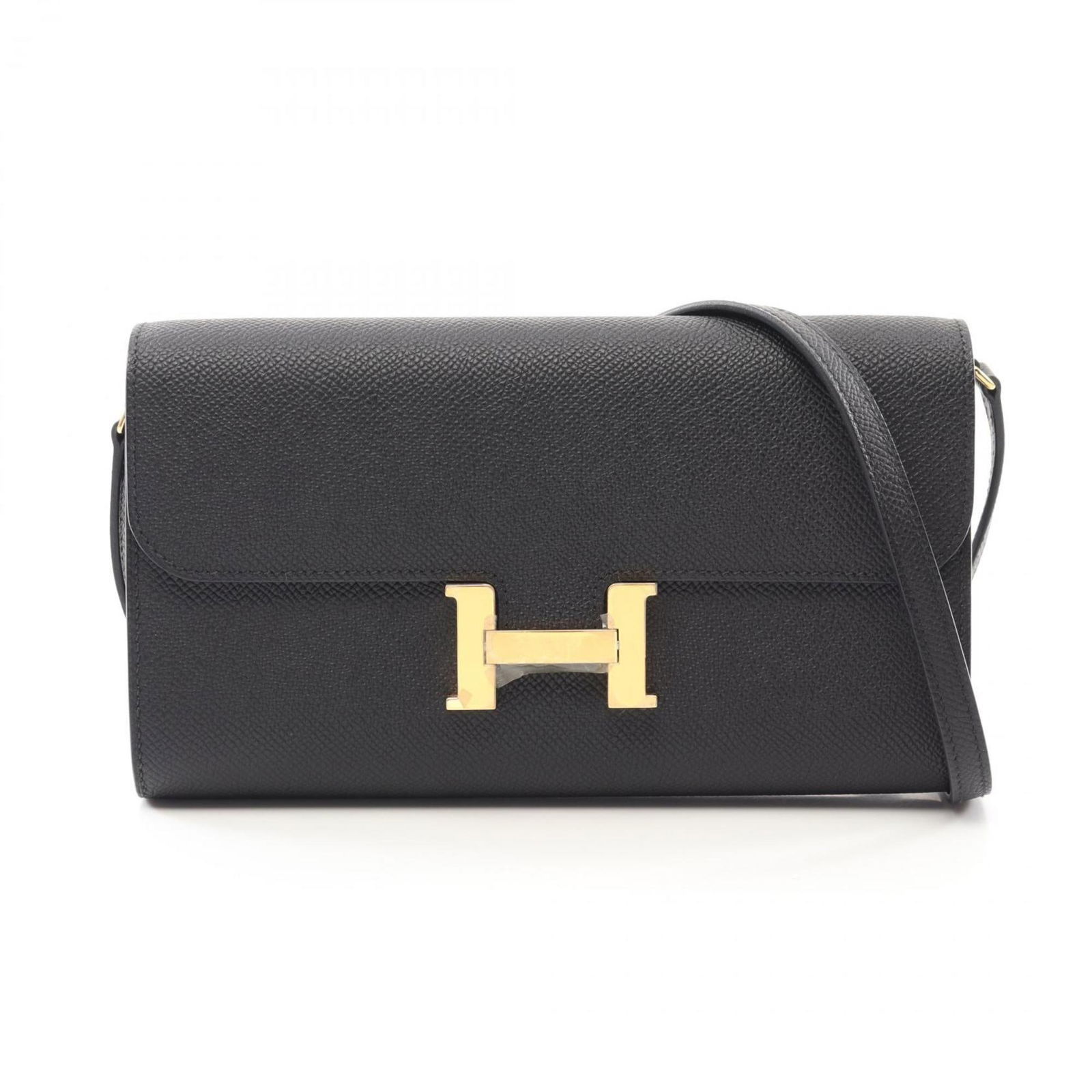 Black Leather Constance Shoulder Bag by Hermes France: Black Leather Constance Shoulder Bag by Hermes France The Hermes Constance is a women's handbag crafted from leather in black. It features a compact design and is made in France. The bag shows traces