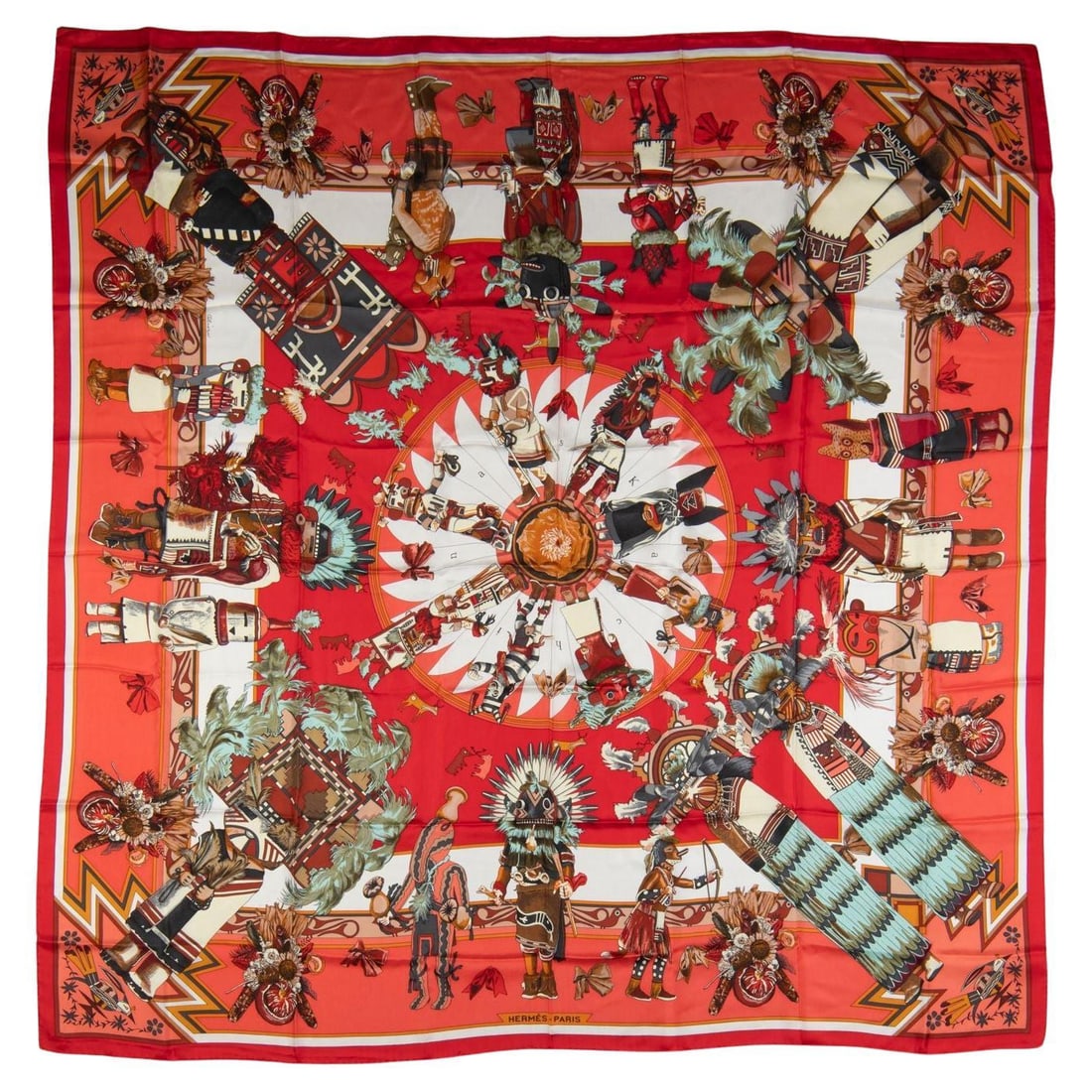 Hermes Kachinas Silk Shawl by Kermit Oliver 52 in Coral: Hermes Kachinas Silk Shawl by Kermit Oliver 52 in Coral Elevate your style with this exquisite Hermes Coral Kachinas Silk Shawl, a stunning accessory designed by Kermit Oliver. Made from luxurious red