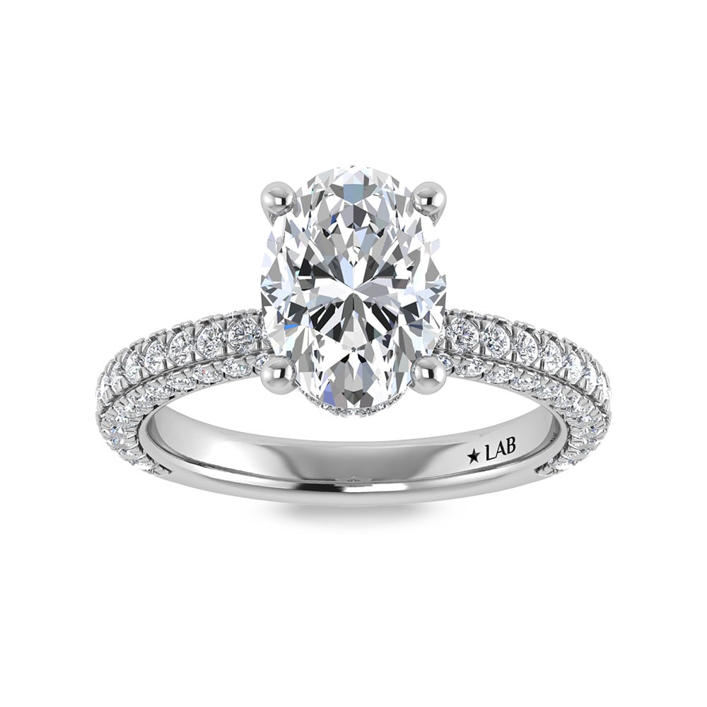 14K White Gold Lab Grown Diamond 4 Ct.Tw. Oval Shape Halo Engagement Ring (IGI Certified Center: 14K White Gold Lab Grown Diamond 4 Ct.Tw. Oval Shape Halo Engagement Ring (IGI Certified Center 3ct) Discover subtle brilliance and modern elegance with our Hidden Halo Diamond Engagement Ring. This e