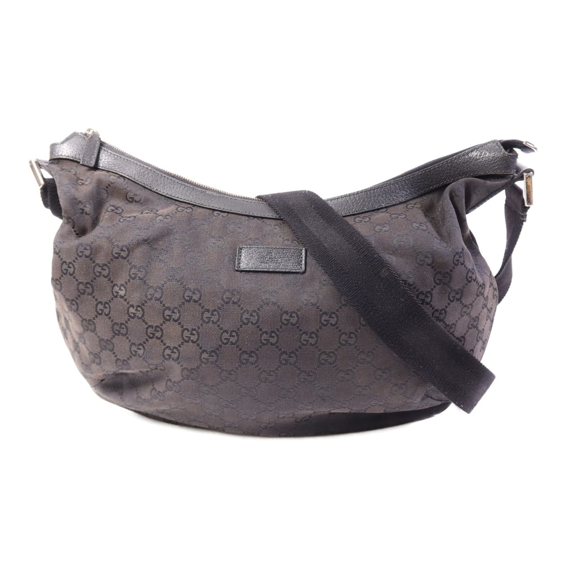 Black GG Canvas Shoulder Bag by Gucci with Silver Tone Hardware: Black GG Canvas Shoulder Bag by Gucci with Silver Tone Hardware This Gucci GG shoulder bag features the iconic GG canvas in black with silver-tone hardware. Crafted in Italy, it offers a sleek silhoue