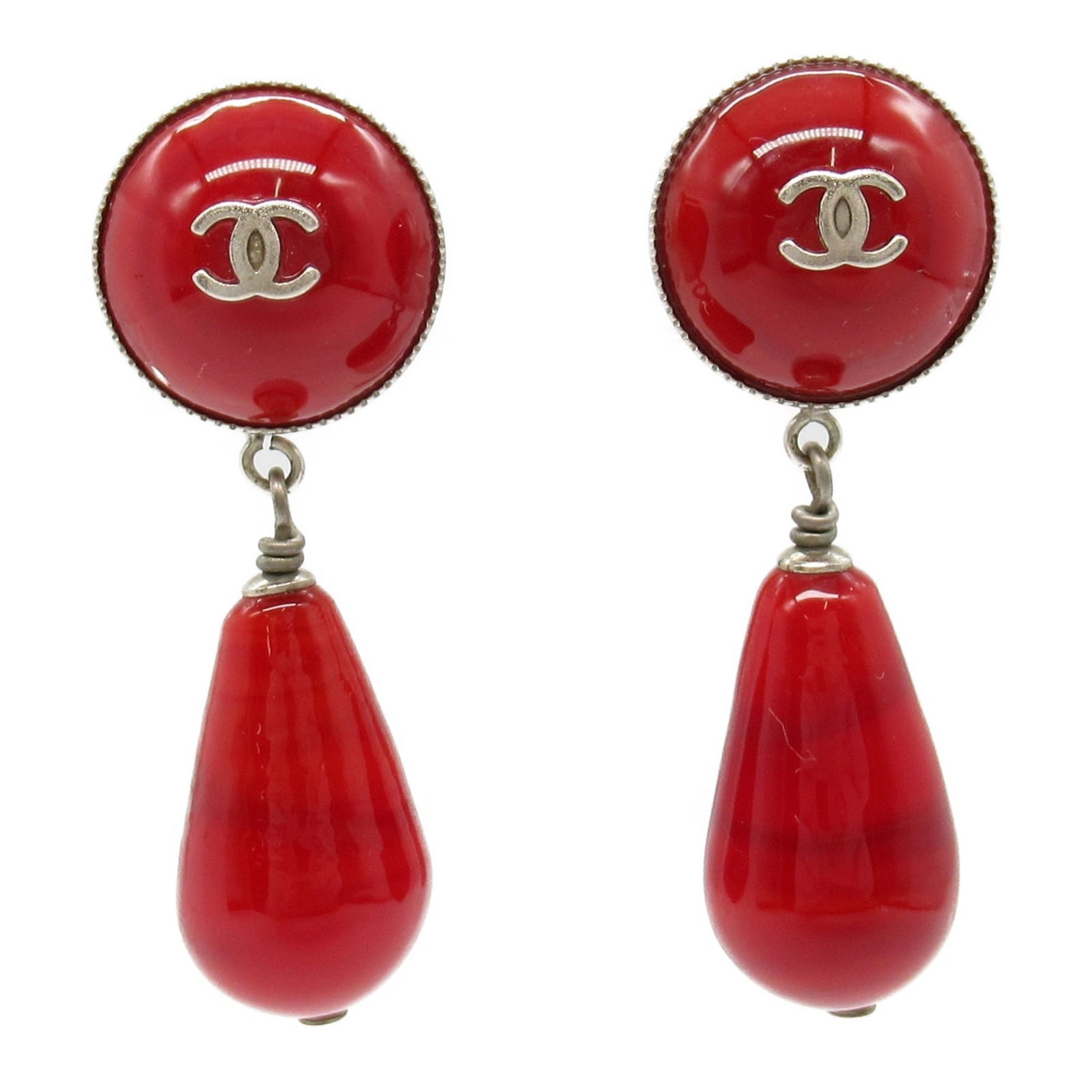 Red Plastic Chanel Coco Mark Accessory 40mm x 14mm: Red Plastic Chanel Coco Mark Accessory 40mm x 14mm This Chanel Coco Mark accessory features a red plastic construction, designed for women. It displays slight scratches, minor stains, some discolorati