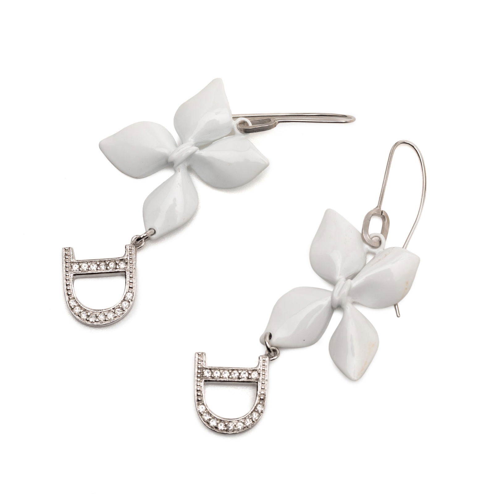 Enamel Flower Drop Earrings with Dior D Logo and Rhinestones: Enamel Flower Drop Earrings with Dior D Logo and Rhinestones These Dior drop earrings feature a white enamel body adorned with rhinestone-embellished D logo and flower motifs. The earrings are finishe