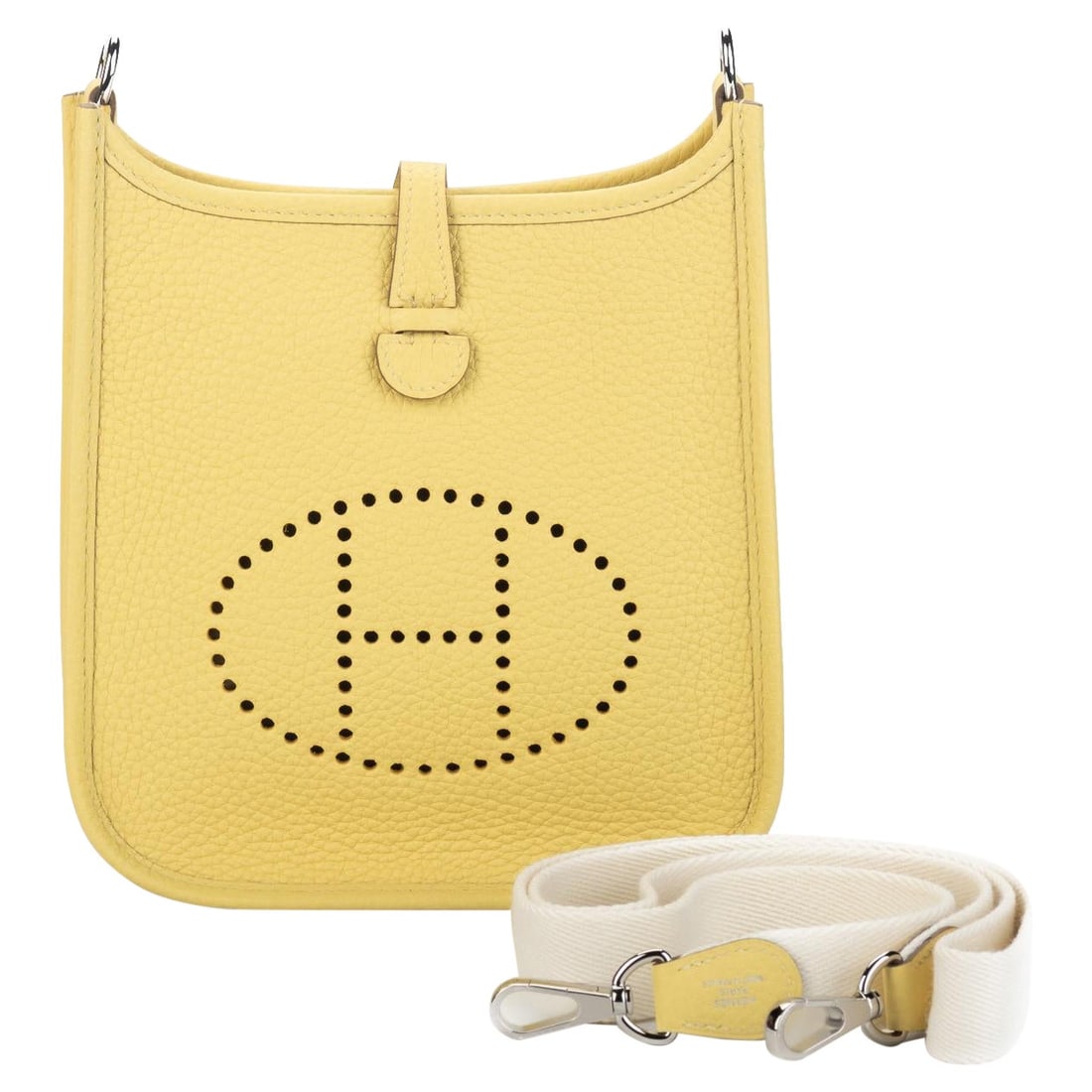 Hermes Mini Evelyne Jaune Poussin Crossbody Bag Clemence Leather: Hermes Mini Evelyne Jaune Poussin Crossbody Bag Clemence Leather Introducing the exquisite Hermes Mini Evelyne Crossbody Bag in a vibrant Jaune Poussin hue. Crafted from luxurious Clemence leather, th