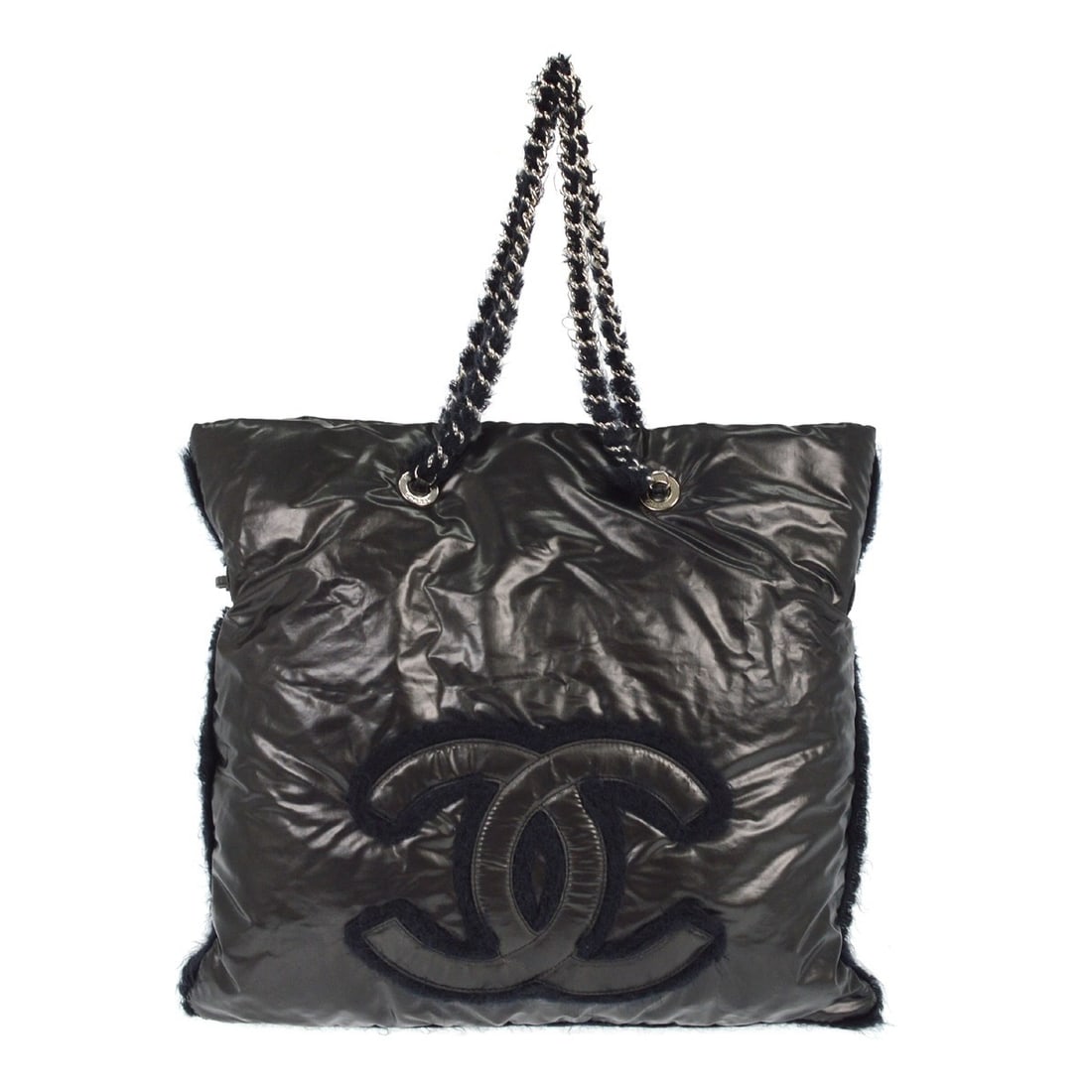 Chanel Large Black Vinyl Tote with Fur Accents and Double Handles: Chanel Large Black Vinyl Tote with Fur Accents and Double Handles This Chanel Polar Bon Bon tote bag features a black PVC exterior with fur detailing, complemented by silver hardware. Designed for cas
