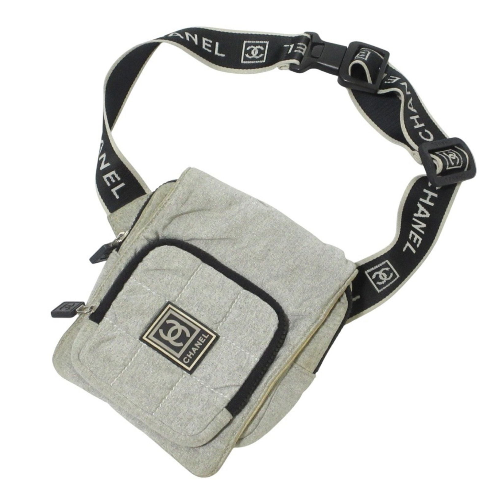 Chanel Sport Line Grey Canvas Shoulder Bag 15 x 19 x 4 cm: Chanel Sport Line Grey Canvas Shoulder Bag 15 x 19 x 4 cm This Chanel Sport line bag features a versatile grey canvas exterior with a unisex design. The bag is crafted in France and offers a compact,