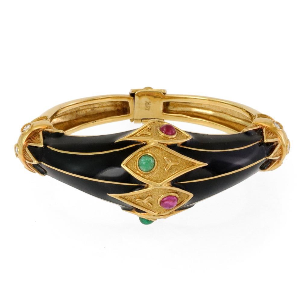 Estate 18k Yellow Gold Dome Bracelet with Diamonds Rubies Emeralds: Estate 18k Yellow Gold Dome Bracelet with Diamonds Rubies Emeralds This stunning estate bracelet showcases exquisite craftsmanship in 18k yellow gold. The bracelet features a hinged design with a secu