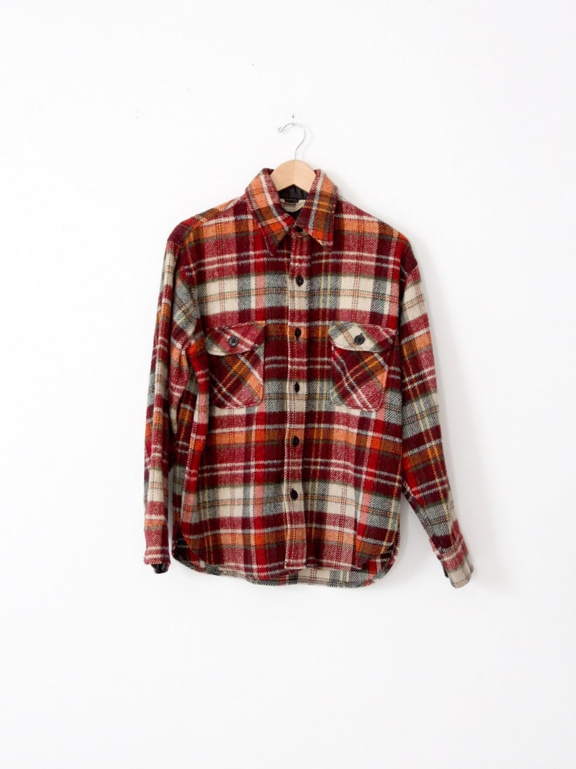 1960s Montgomery Ward Wool Plaid Shirt Jacket with Pockets: 1960s Montgomery Ward Wool Plaid Shirt Jacket with Pockets Discover this stylish late 1960s vintage Montgomery Ward plaid shirt jacket, crafted from thick wool to provide warmth and comfort. The jacke