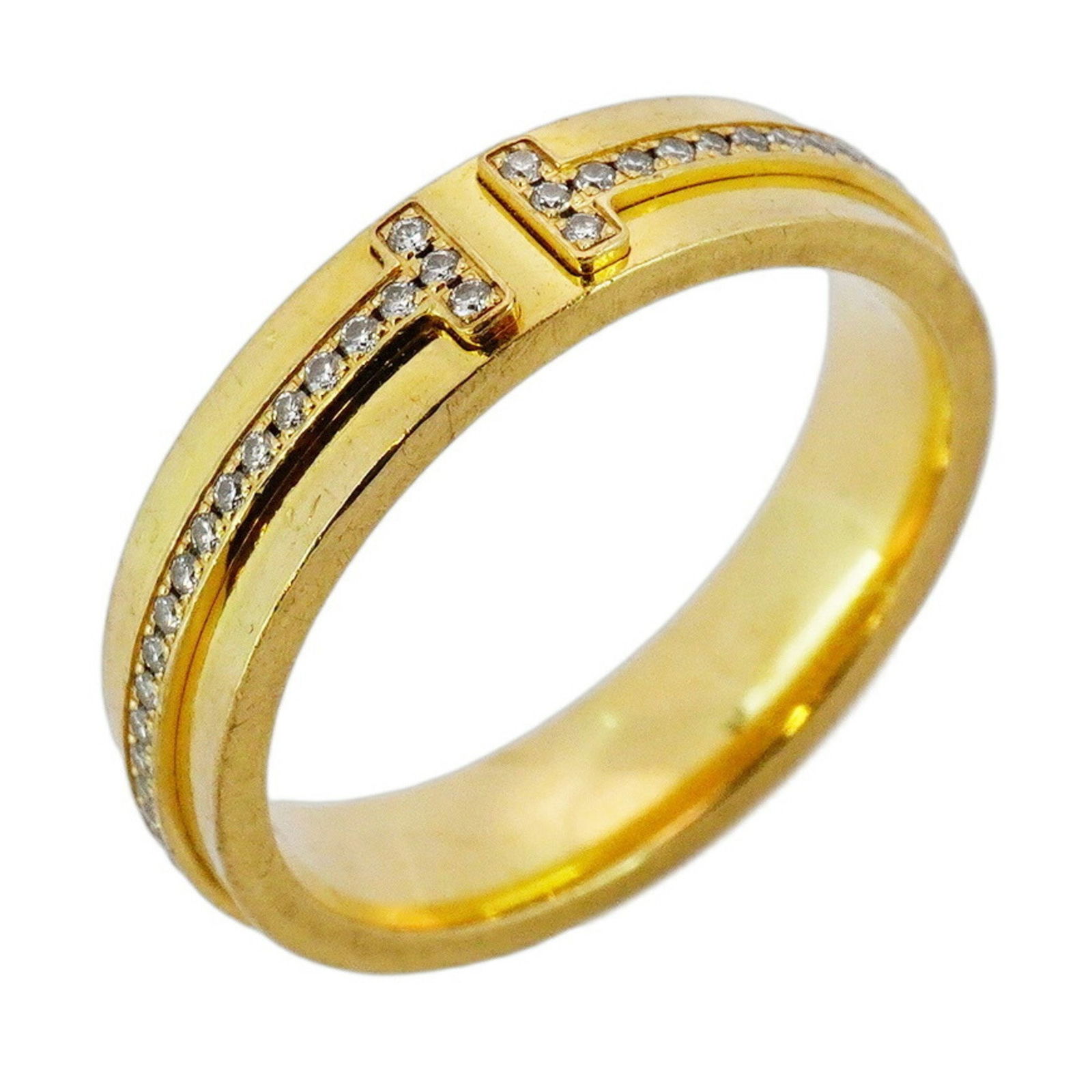 Yellow Gold T Wire Bracelet by Tiffany & Co 6.5 Inch: Yellow Gold T Wire Bracelet by Tiffany & Co 6.5 Inch This Tiffany & Co. T wire bracelet features a sleek design crafted from yellow gold. Suitable for women, it is sized at 6.5. The bracelet shows som