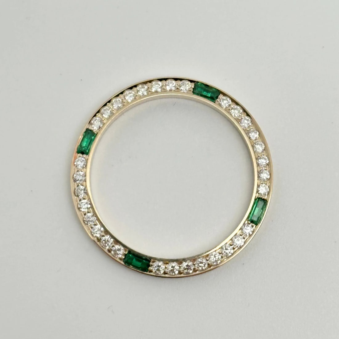 Custom 14K Yellow Gold Bezel with Diamonds Green Sapphires for Rolex Datejust 69173: Custom 14K Yellow Gold Bezel with Diamonds Green Sapphires for Rolex Datejust 69173 Elevate your Rolex Datejust with this luxurious custom bezel crafted from 14K yellow gold. Adorned with striking gre