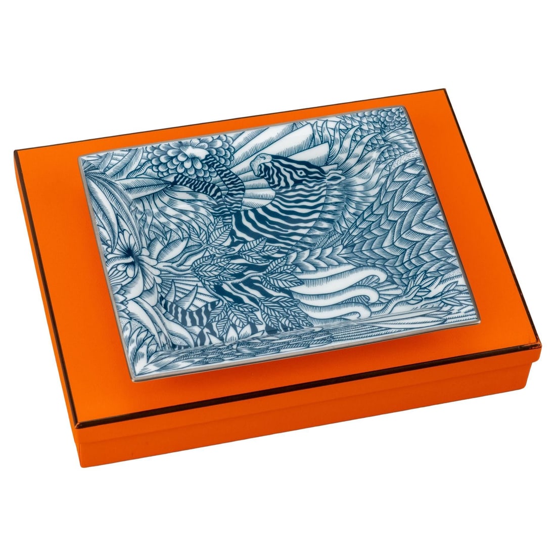 Hermes Zebra Design Blue Porcelain Ashtray with Box: Hermes Zebra Design Blue Porcelain Ashtray with Box This exquisite Hermes blue and white porcelain ashtray features a striking zebra design, making it a stylish addition to any decor. Crafted in the 2
