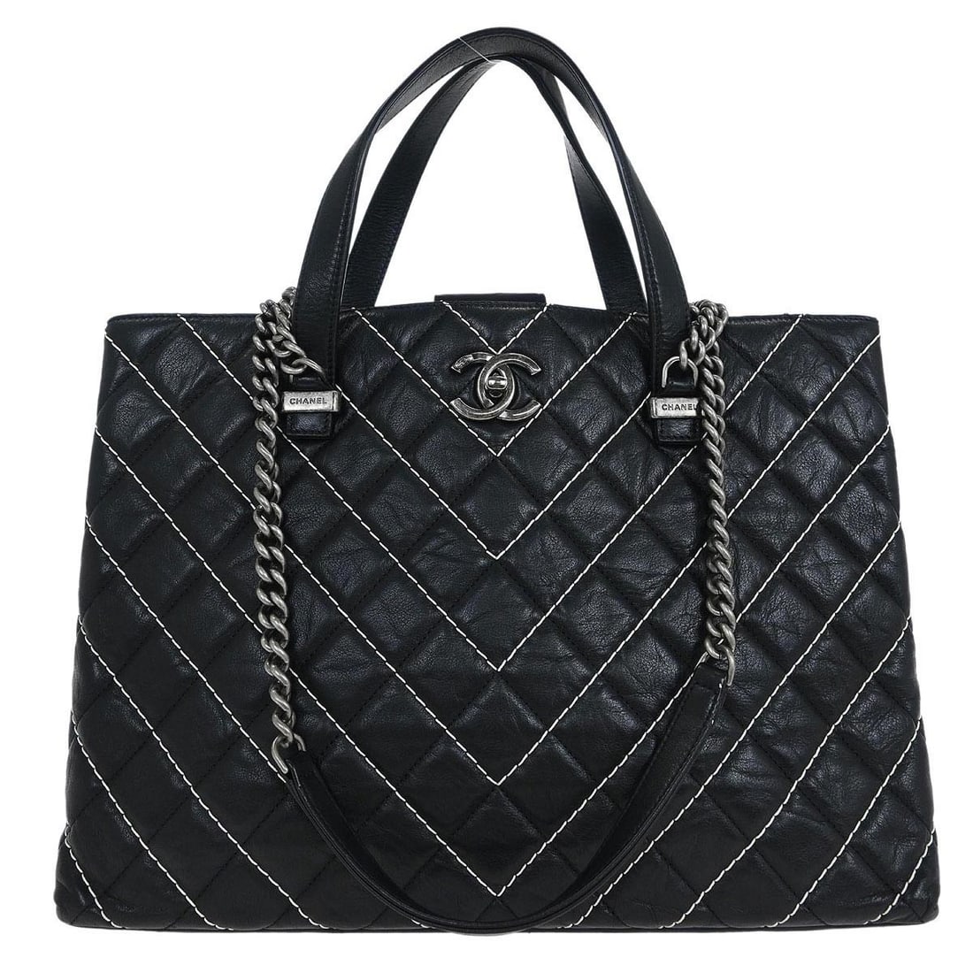 Chanel Black Calfskin Chevron Tote 2way Shoulder Handbag Italy: Chanel Black Calfskin Chevron Tote 2way Shoulder Handbag Italy This elegant Chanel Black Calfskin Chevron Tote is perfect for both casual and formal occasions. Crafted from high-quality leather, this
