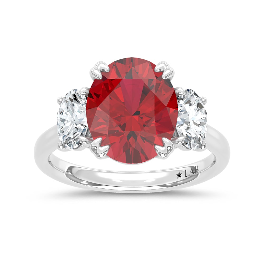 14K White Gold Lab Grown Diamond 6 Ct.Tw. Oval Shape Recrystalized Ruby Engagement Ring (Center 5: 14K White Gold Lab Grown Diamond 6 Ct.Tw. Oval Shape Recrystalized Ruby Engagement Ring (Center 5 ct) Elevate your elegance with this 14K white gold engagement ring. Its centerpiece is a dazzling 5