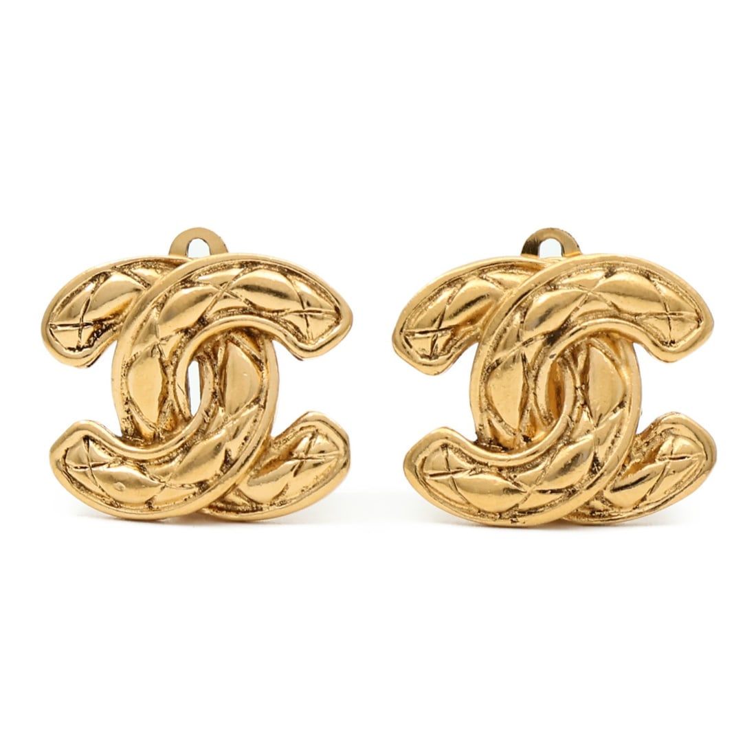 Gold Tone CHANEL CC Logo Earrings: Gold Tone CHANEL CC Logo Earrings These CHANEL CC earrings feature a gold-tone metal design, crafted in France. The earrings are styled without any stones, showcasing the iconic CC logo. They are desi