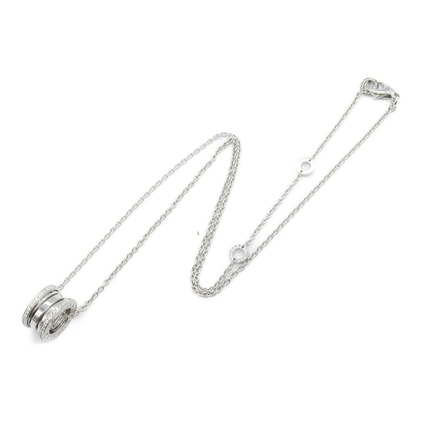 White Gold B.Zero1 Necklace by Bulgari 15mm Pendant Adjustable Length: White Gold B.Zero1 Necklace by Bulgari 15mm Pendant Adjustable Length This Bulgari B.Zero1 necklace features a sleek design crafted from white gold in a silver tone. The necklace is designed for women