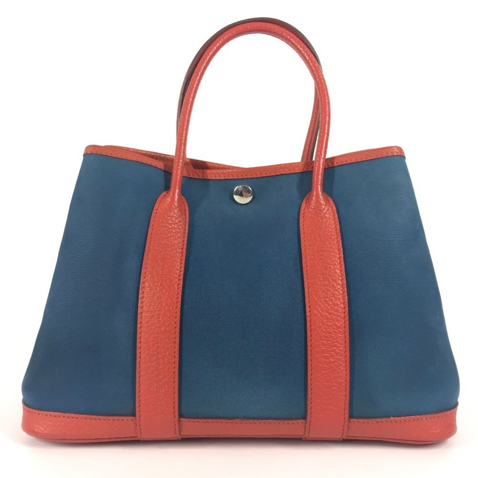 Blue Canvas Hermes Garden Party Tote Bag 20cm x 30cm: Blue Canvas Hermes Garden Party Tote Bag 20cm x 30cm This Hermes Garden Party handbag features a blue canvas exterior and is designed for women. The bag is crafted in France and offers a spacious inte