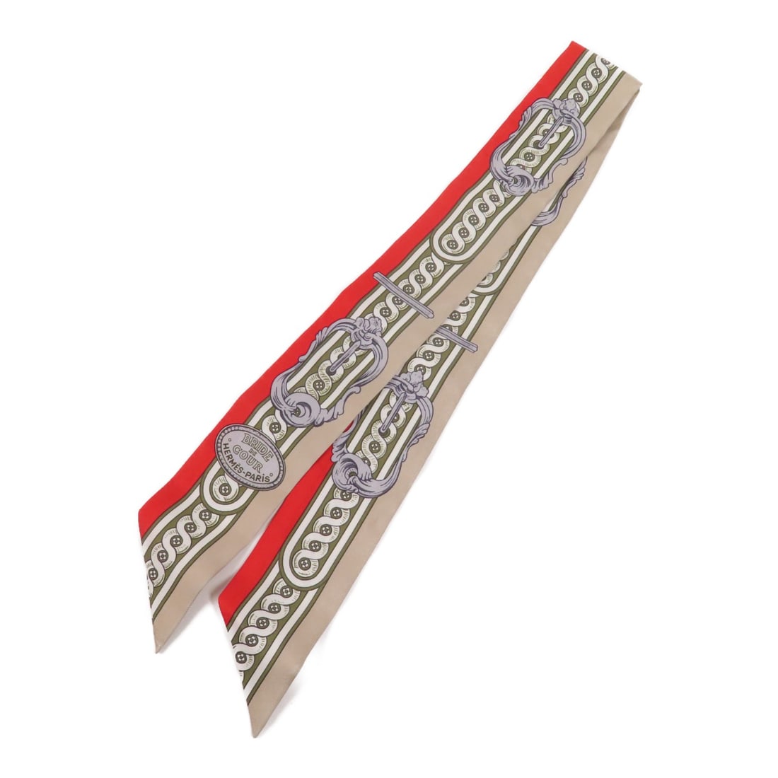 HERMES Silk Twilly Scarf in Beige and Red: HERMES Silk Twilly Scarf in Beige and Red This exquisite HERMES Twilly Scarf is crafted from luxurious silk, featuring a beautiful beige and red color palette. Perfectly designed to elevate any outfit