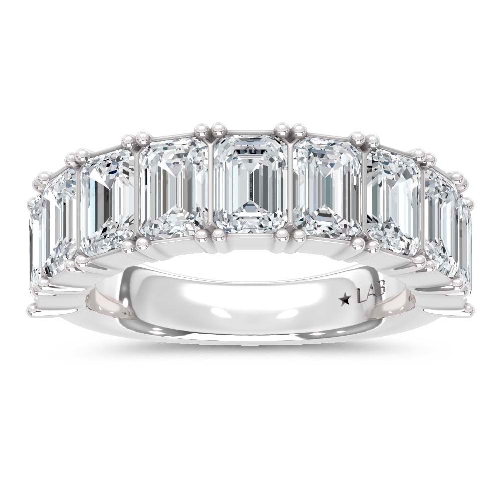 14K White Gold Lab Grown Diamond Emerald Cut Shape 5 Ct.Tw. Half Way Band: 14K White Gold Lab Grown Diamond Emerald Cut Shape 5 Ct.Tw. Half Way Band With 5 Ct.Tw. of stunning Emerald Cut Lab Grown Diamonds, this 14K White Gold Band offers unmatched luxury. The brilliance of