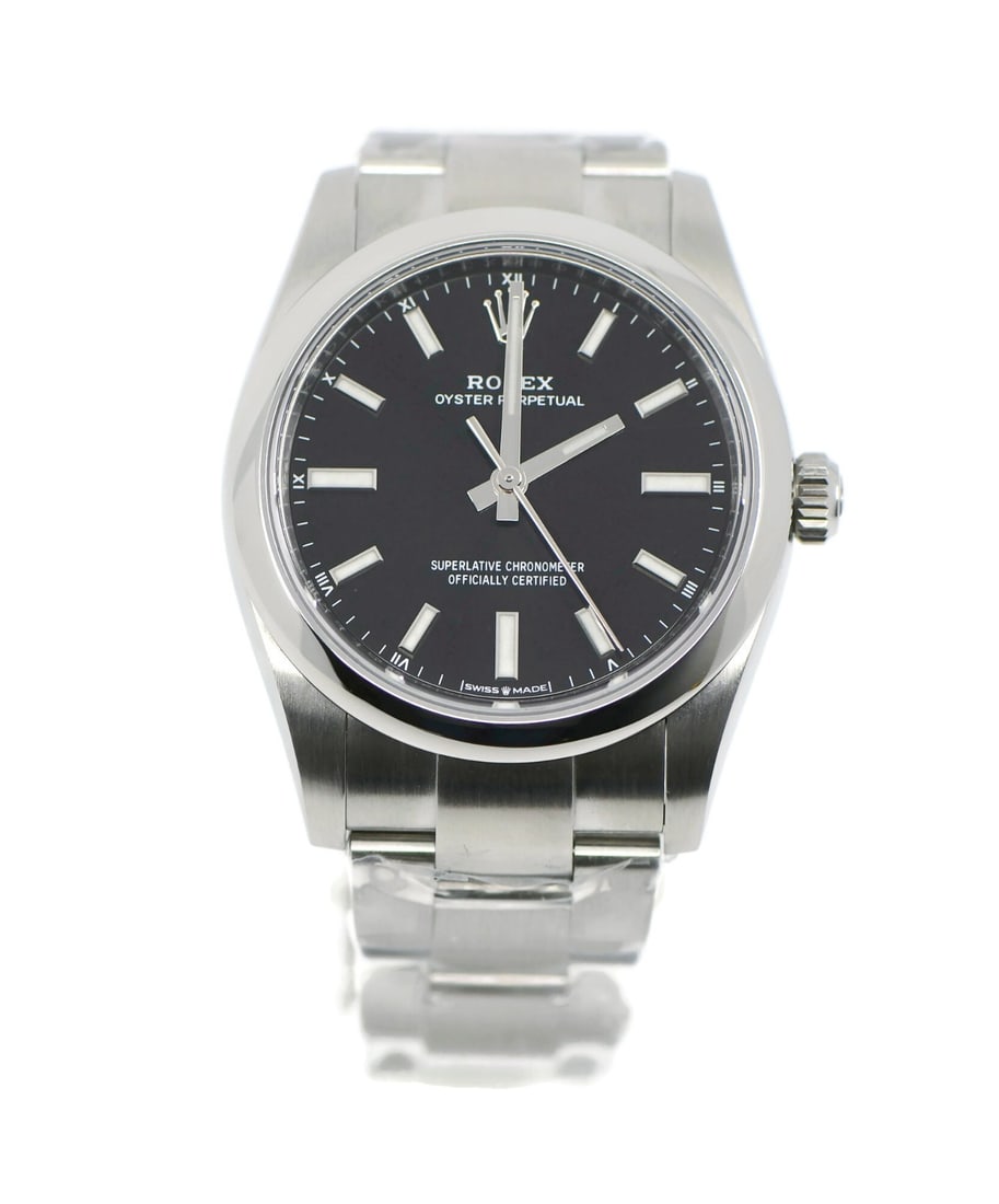 Rolex Oyster Perpetual 34mm Stainless Steel Watch Ref 124200 with Box and Papers: Rolex Oyster Perpetual 34mm Stainless Steel Watch Ref 124200 with Box and Papers Experience the timeless elegance of the Rolex Oyster Perpetual 34, a classic wristwatch that embodies precision and lux