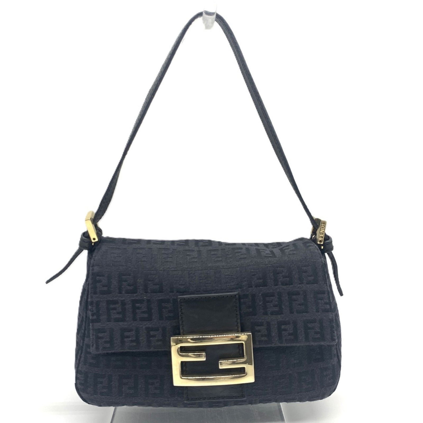 Fendi Black Canvas Mamma Baguette Shoulder Bag Italy: Fendi Black Canvas Mamma Baguette Shoulder Bag Italy This Fendi Mamma Baguette handbag features a black canvas exterior and is designed for women. The bag is crafted in Italy and has dimensions of 12c