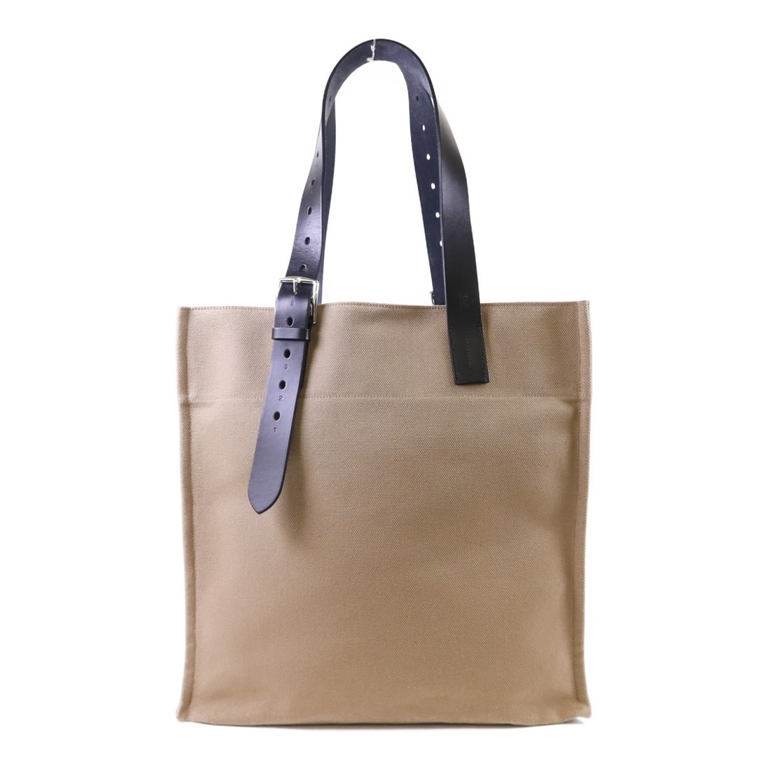 Hermes Etriviere Canvas Tote in Beige Marfa Noir with Palladium Hardware: Hermes Etriviere Canvas Tote in Beige Marfa Noir with Palladium Hardware This Hermes Etriviere tote bag features a beige canvas exterior and is accented with palladium hardware. The spacious design ma