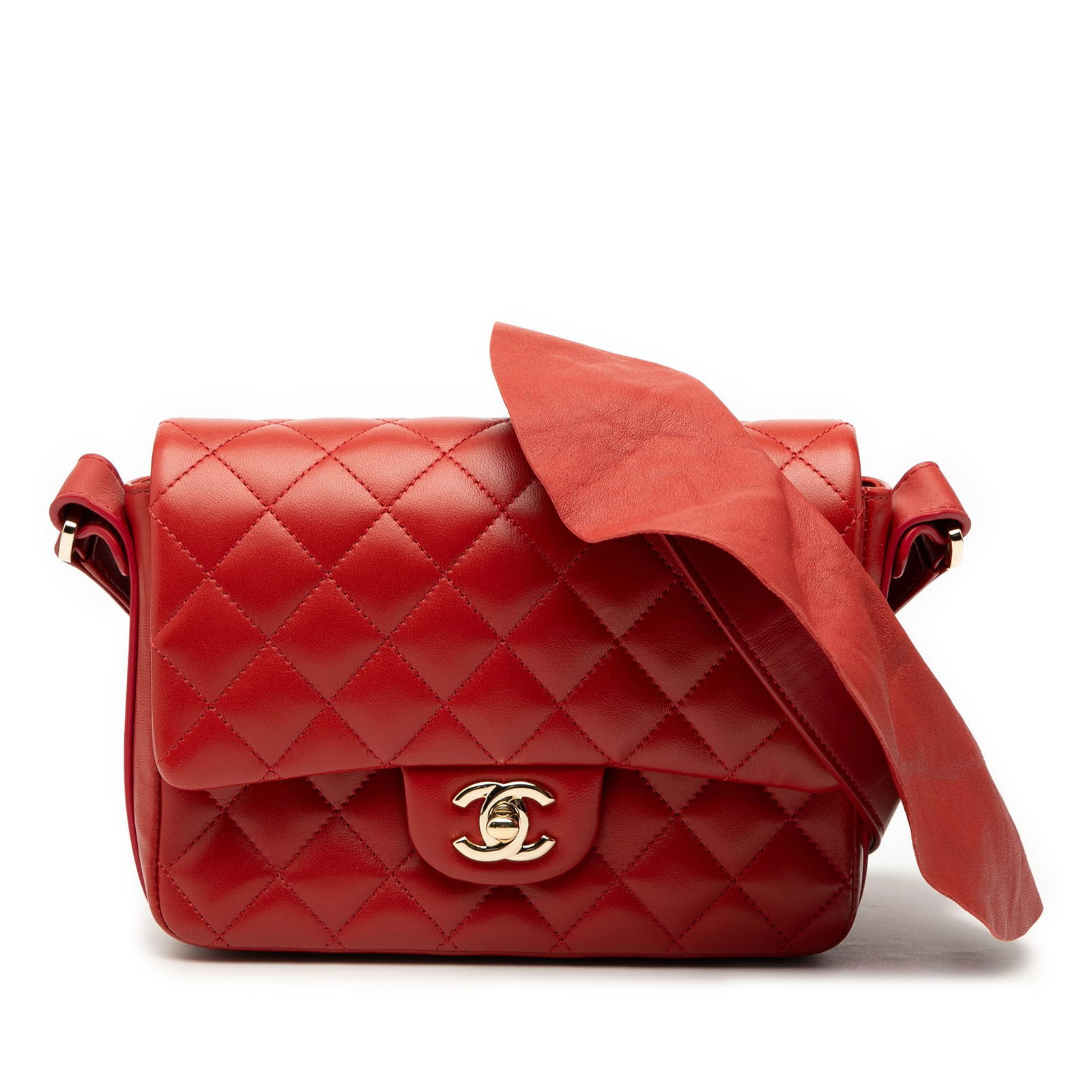 Chanel CC Quilted Calfskin Ruffle Strap Flap Bag Red: Chanel CC Quilted Calfskin Ruffle Strap Flap Bag Red This Chanel CC Quilted Calfskin Ruffle Strap Flap bag is a stylish accessory crafted from luxurious quilted lambskin leather. It features a front f
